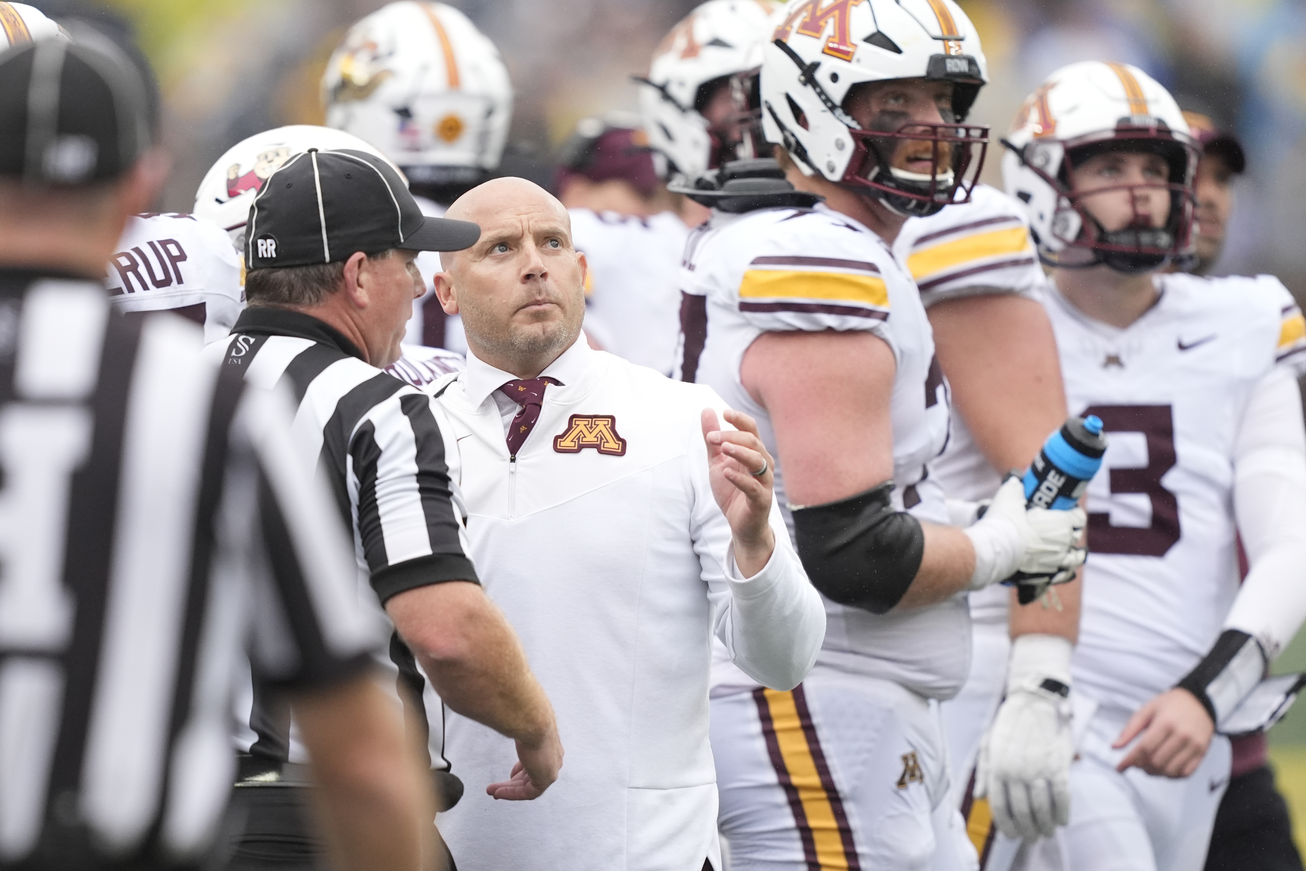Minnesota head coach P.J. Fleck talks to the referees during the second half of an NCAA college football game against Michigan, Saturday, Sept. 28, 2024, in Ann Arbor, Mich. 
