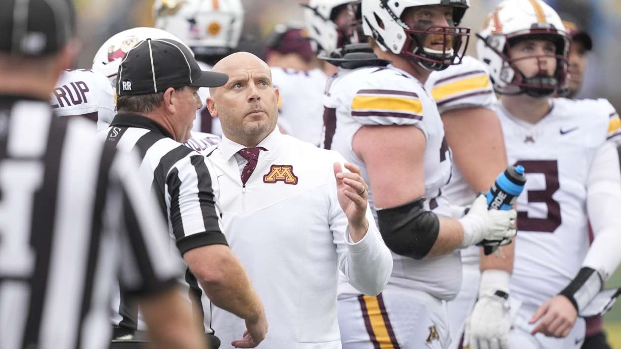 Minnesota head coach P.J. Fleck talks to the referees during the second half of an NCAA college football game against Michigan, Saturday, Sept. 28, 2024, in Ann Arbor, Mich.