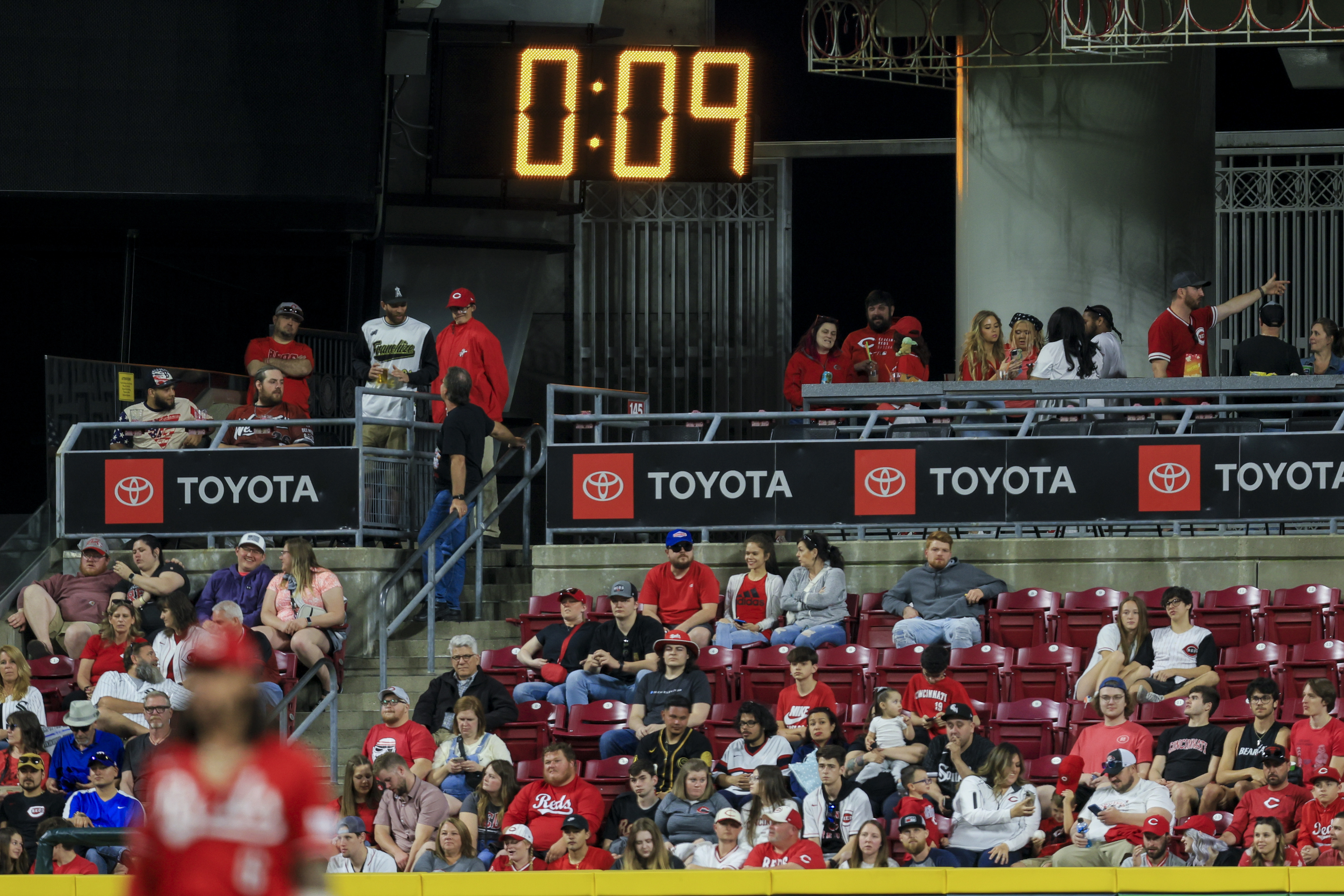FILE - The pitch clock is seen in the outfield during a baseball game between the Chicago White Sox and the Cincinnati Reds in Cincinnati, Friday, May 5, 2023. 