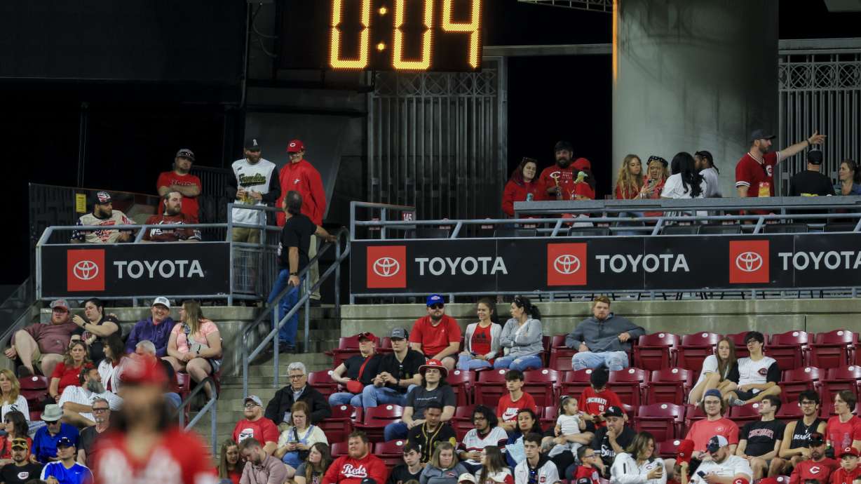 FILE - The pitch clock is seen in the outfield during a baseball game between the Chicago White Sox and the Cincinnati Reds in Cincinnati, Friday, May 5, 2023.
