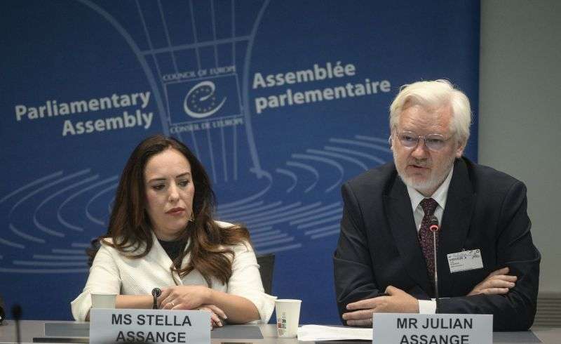 Wikileaks founder Julian Assange, right, assesses the Council of Europe while his wife Stella Assange sits next to him, in Strasbourg, France, Tuesday.