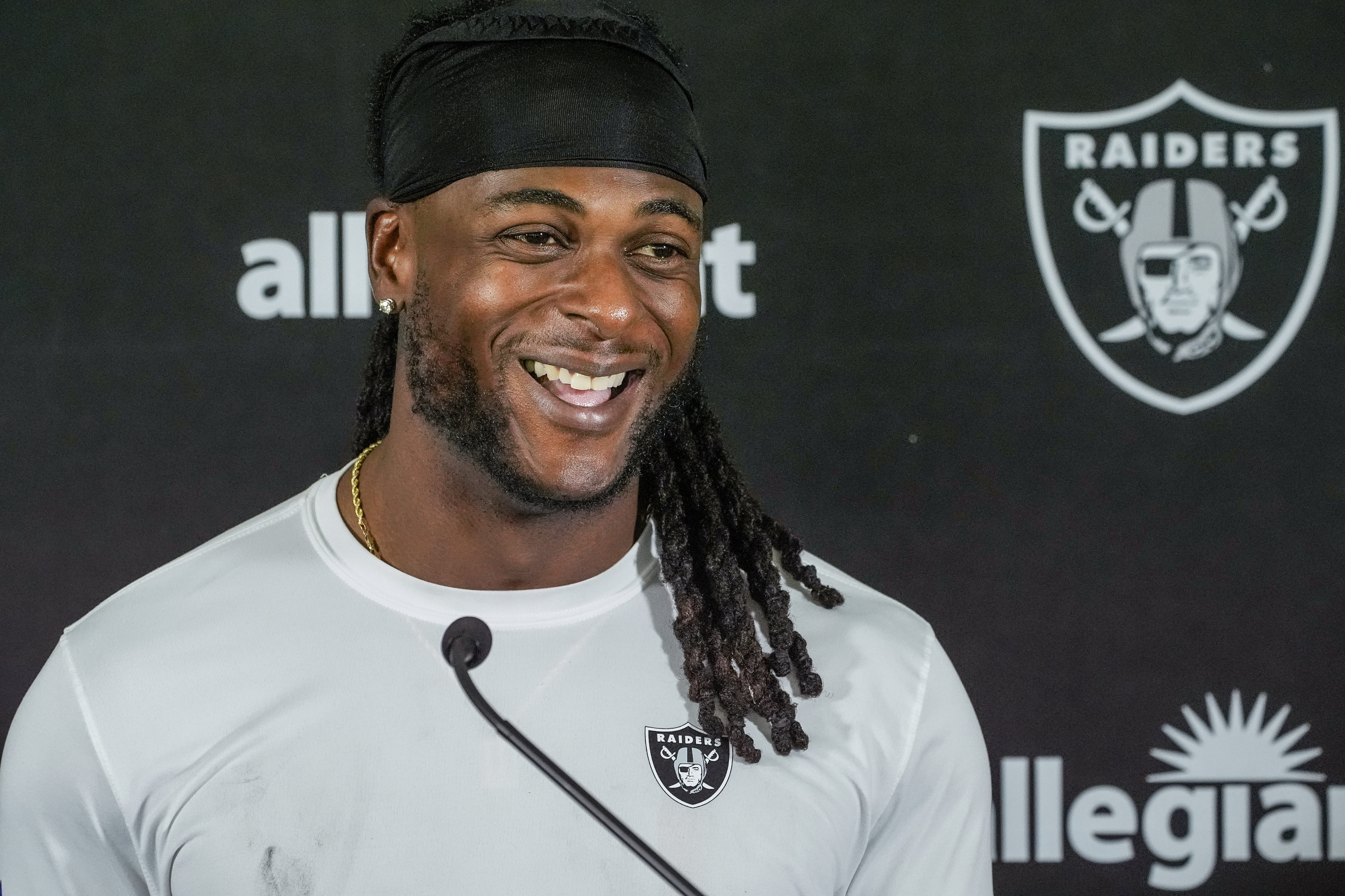 FILE - Las Vegas Raiders wide receiver Davante Adams (17) takes questions from the media after a NFL football training camp at Jack R. Hammett Sports Complex in Costa Mesa, Calif., July 24, 2024. 