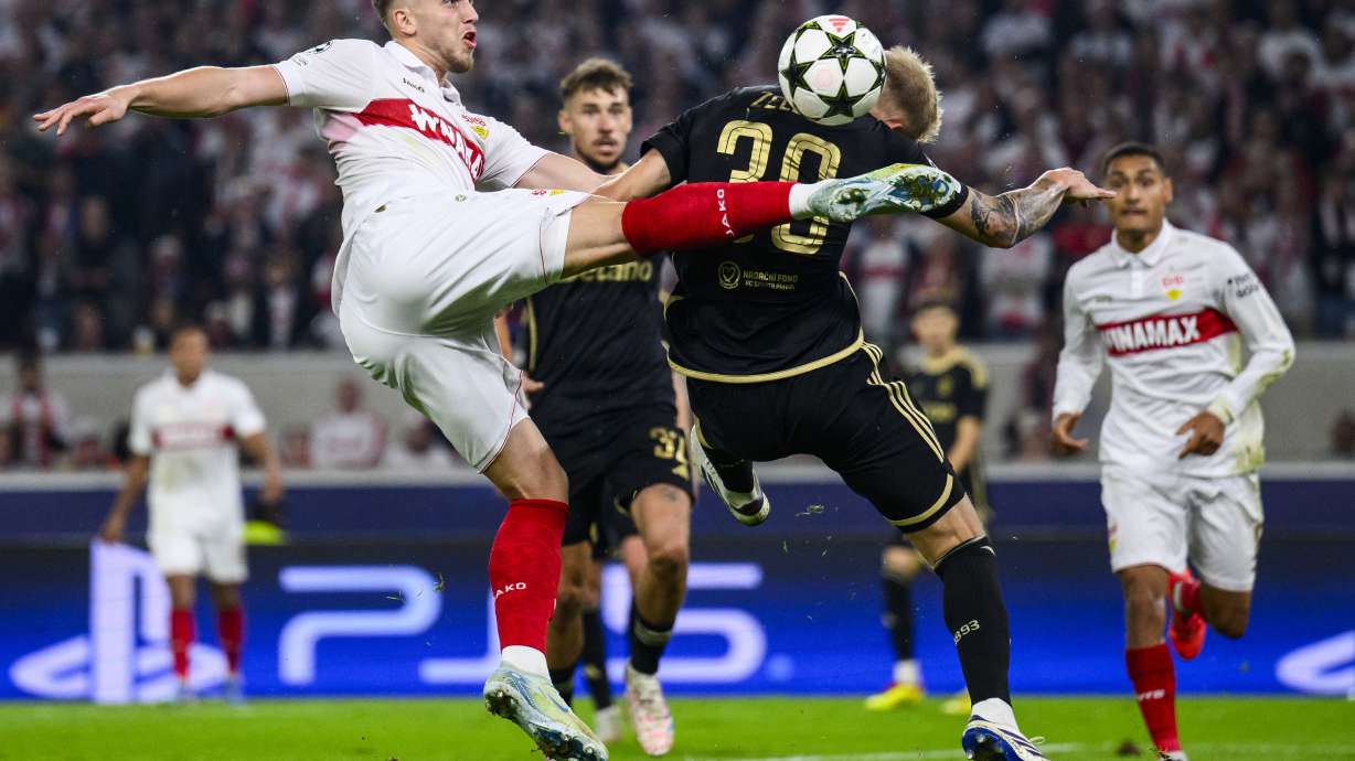 Stuttgart's Ermedin Demirovic, front left, and Prague's Jaroslav, front right, challenge for the ball during the Champions League opening phase soccer match between VfB Stuttgart and AC Sparta Praha in Stuttgart, Germany, Tuesday, Oct. 1, 2024.
