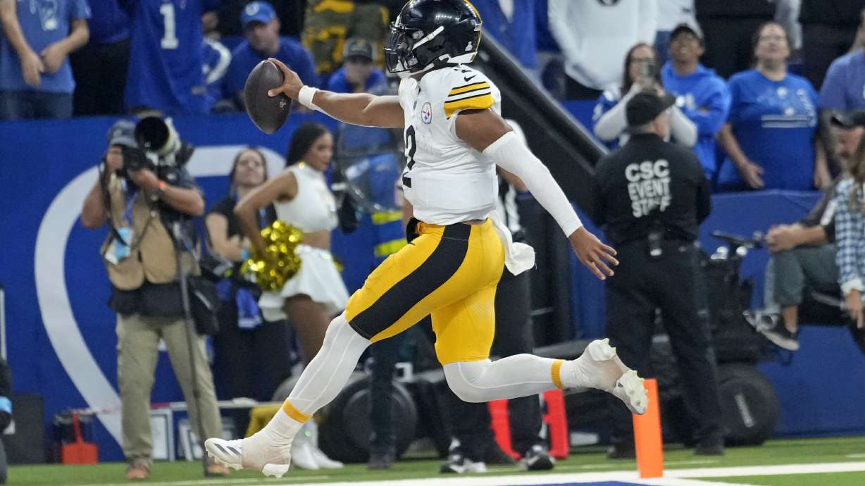 Pittsburgh Steelers quarterback Justin Fields (2) leaps into the end zone for a touchdown during the second half of an NFL football game against the Indianapolis Colts, Sunday, Sept. 29, 2024, in Indianapolis.