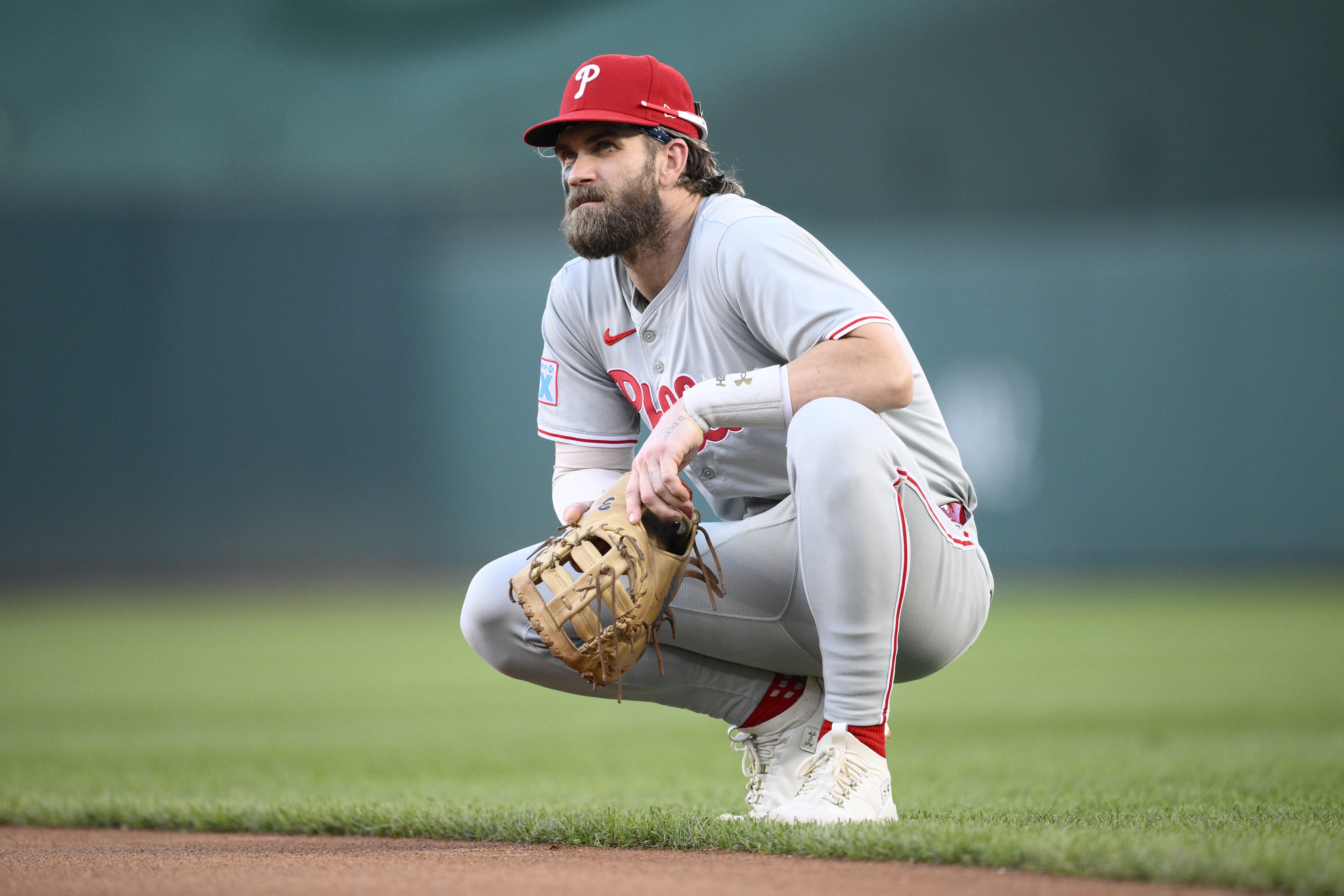 Philadelphia Phillies first baseman Bryce Harper looks on as he awaits the results of a video review for a play at second during the seventh inning of a baseball game against the Washington Nationals, Saturday, Sept. 28, 2024, in Washington. The Nationals won 6-3.