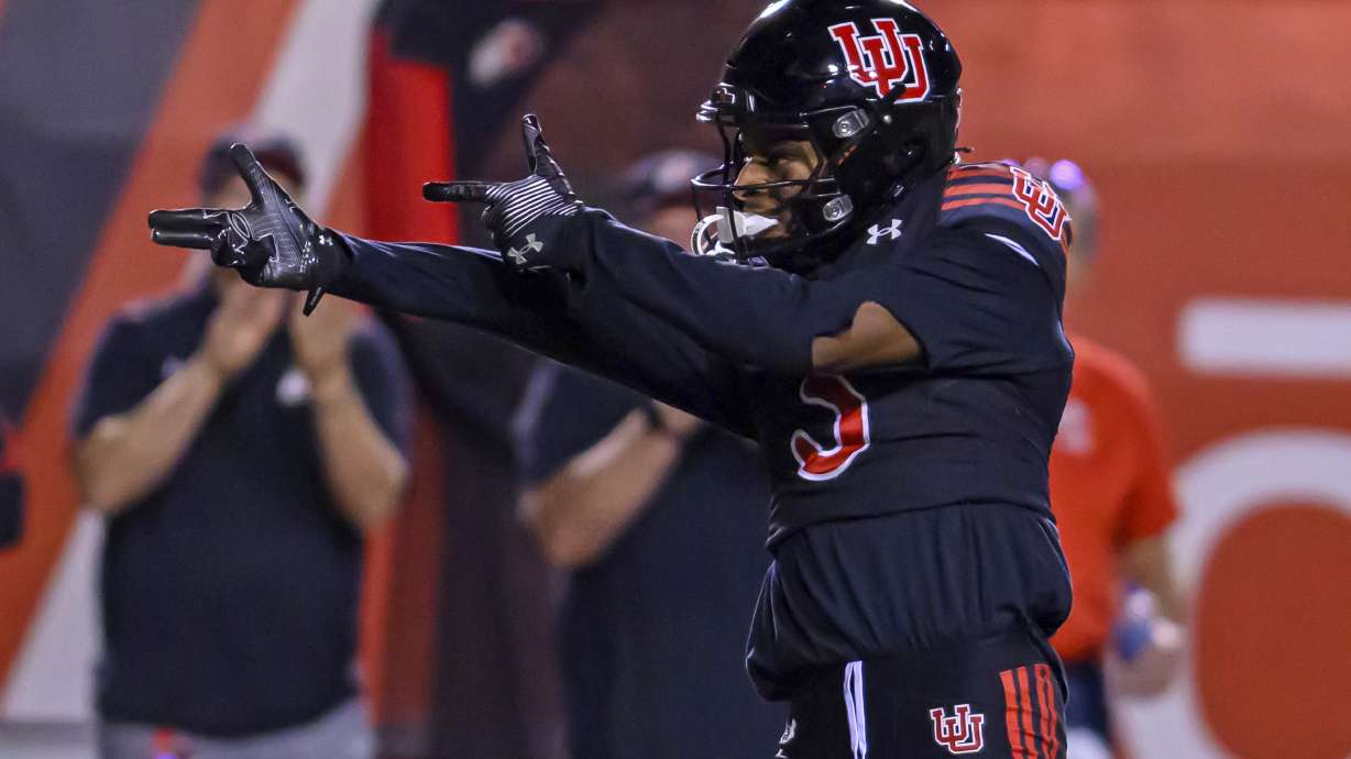 Utah wide receiver Dorian Singer signals first down after making a leaping catch during an NCAA college football game against Arizona, Saturday, Sept. 28, 2024, in Salt Lake City, Utah.