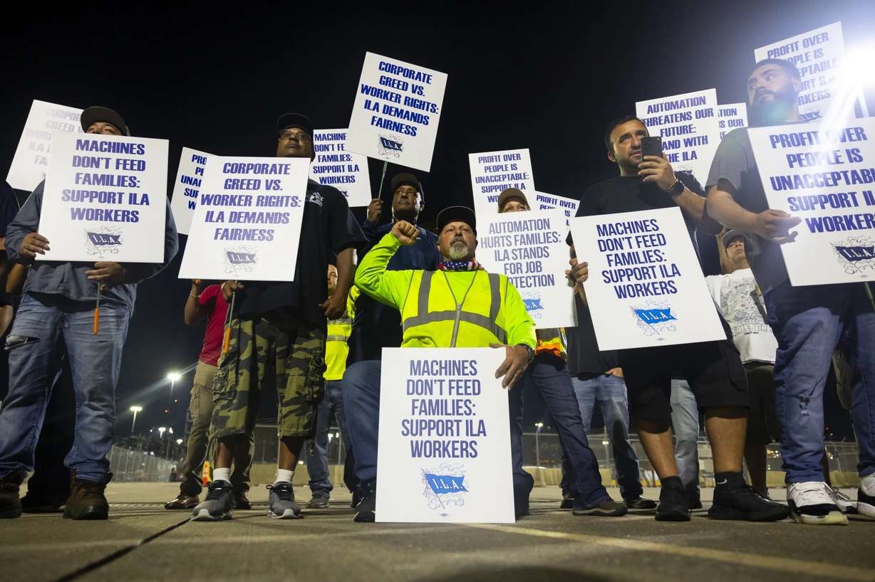 Longshoremen strike at midnight at Bayport Terminal on Tuesday in Houston, Texas.