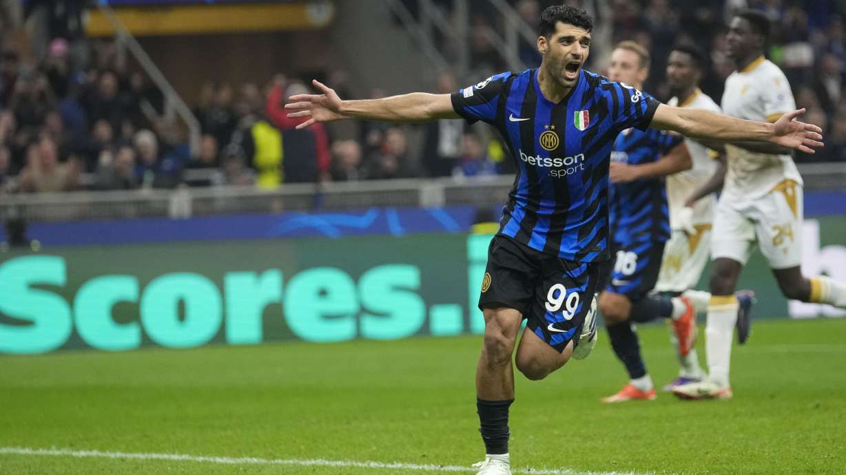 Inter Milan's Mehdi Taremi celebrates after scoring his side's fourth goal from penalty spot during the Champions League opening phase soccer match between Inter Milan and Red Star, at the San Siro stadium in Milan, Italy, Tuesday, Oct. 1, 2024.