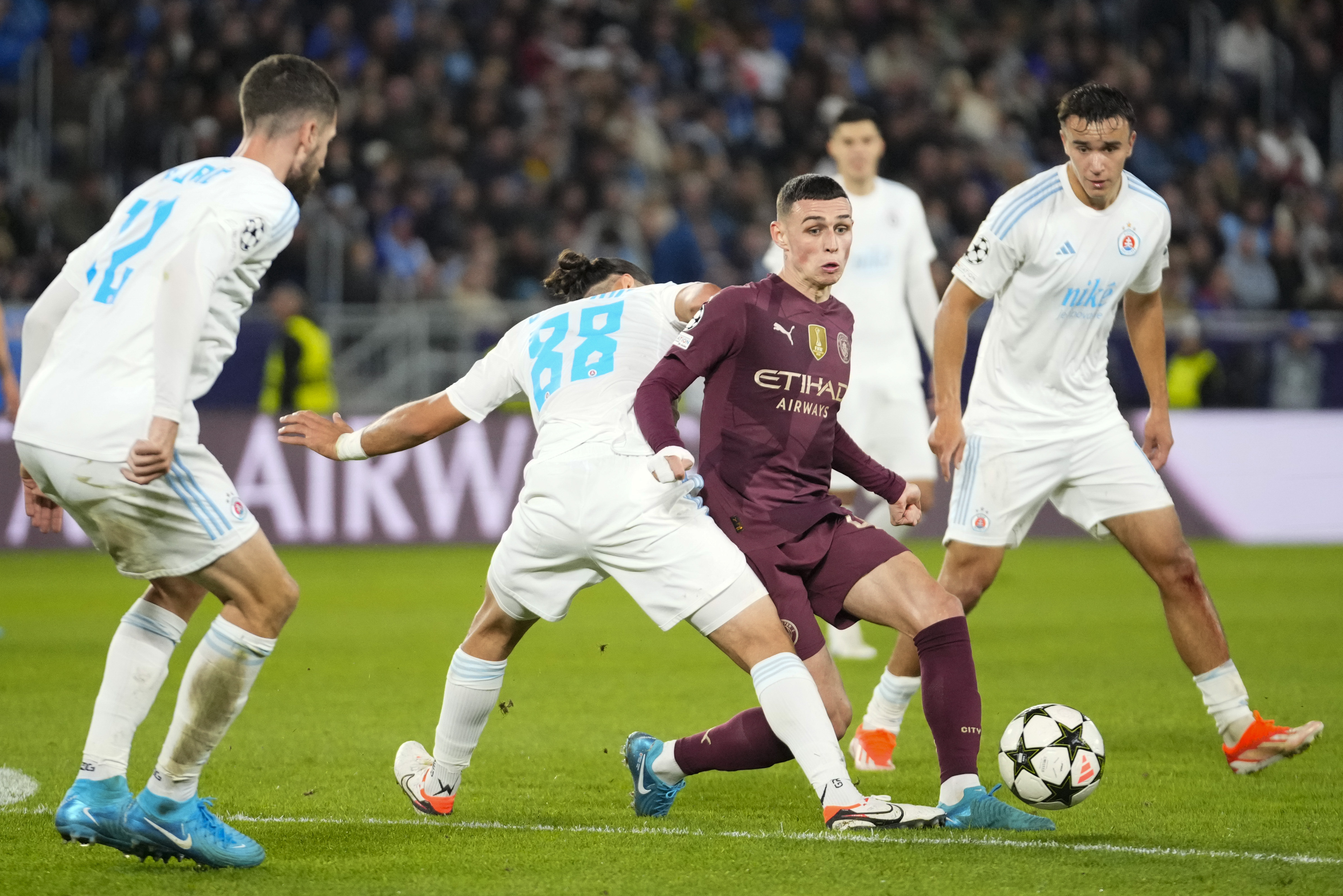 Manchester City's Phil Foden gets closed down during the Champions League opening phase soccer match between Slovan Bratislava and Manchester City in Bratislava, Slovakia, Tuesday, Oct. 1, 2024. 