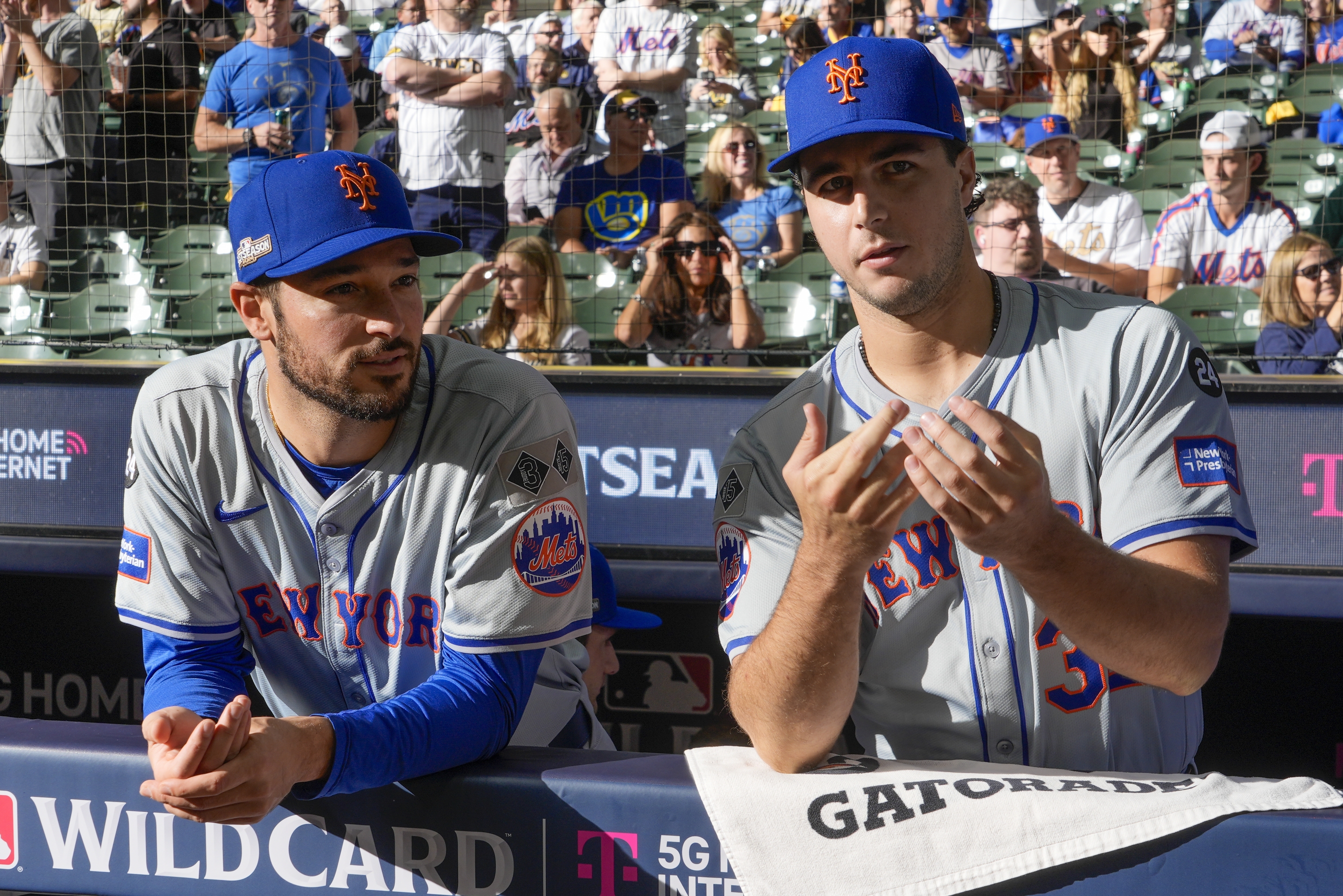 New York Mets' Max Kranick talks to New York Mets' Danny Young before Game 1 of a National League wild card baseball game against the Milwaukee Brewers Tuesday, Oct. 1, 2024, in Milwaukee. 