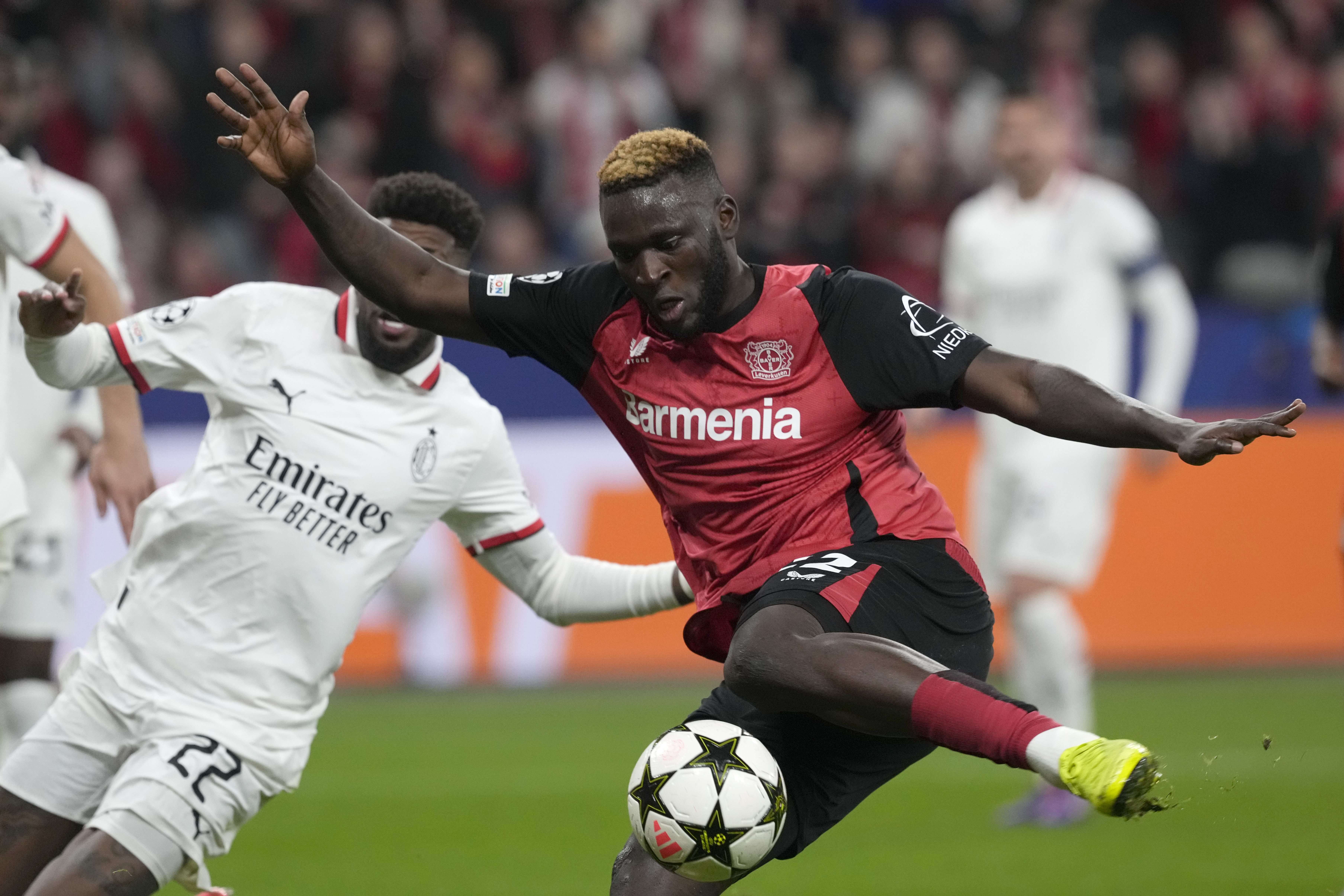 Leverkusen's Victor Boniface scores his side's opening goal during the Champions League soccer match between Bayer Leverkusen and AC Milan at the BayArena in Leverkusen, Germany, Tuesday, Oct.1, 2024. 