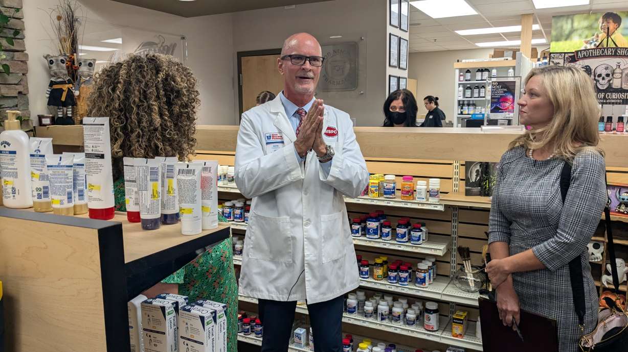 Local pharmacist Kevin DeMass speaks with Utah's 2nd District Rep. Celeste Maloy, left, and Melissa Holyoak, right, a federal trade commissioner, about the problems with high prescription drug prices.