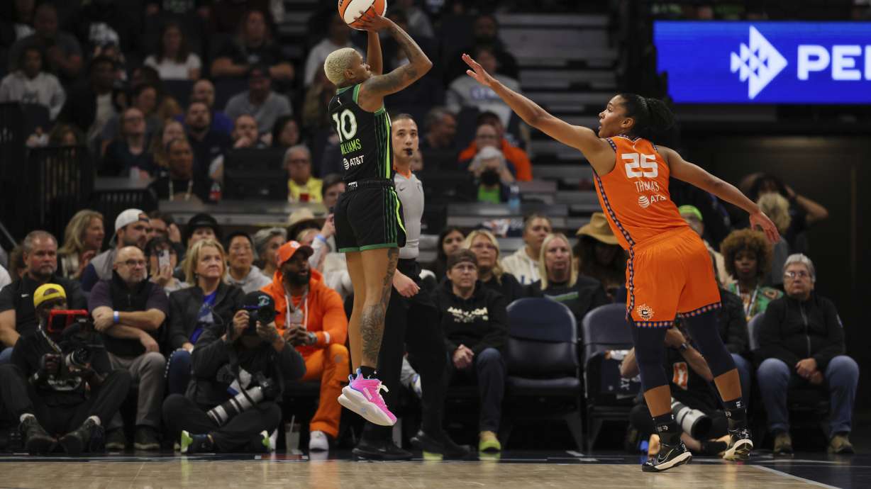 Guard Courtney Williams (10) of the Minnesota Lynx shoots the ball as forward Alyssa Thomas (25) of the Connecticut Sun defends during the first half of Game 2 of a WNBA basketball semifinals game, at Target Center, Tuesday, October 1, 2024, in Minneapolis, Minn.