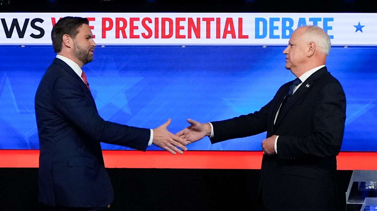 Republican vice presidential nominee Sen. JD Vance, R-Ohio, left, and Democratic vice presidential nominee Minnesota Gov. Tim Walz, shake hands as they arrive for a CBS News vice presidential debate, Tuesday, in New York.