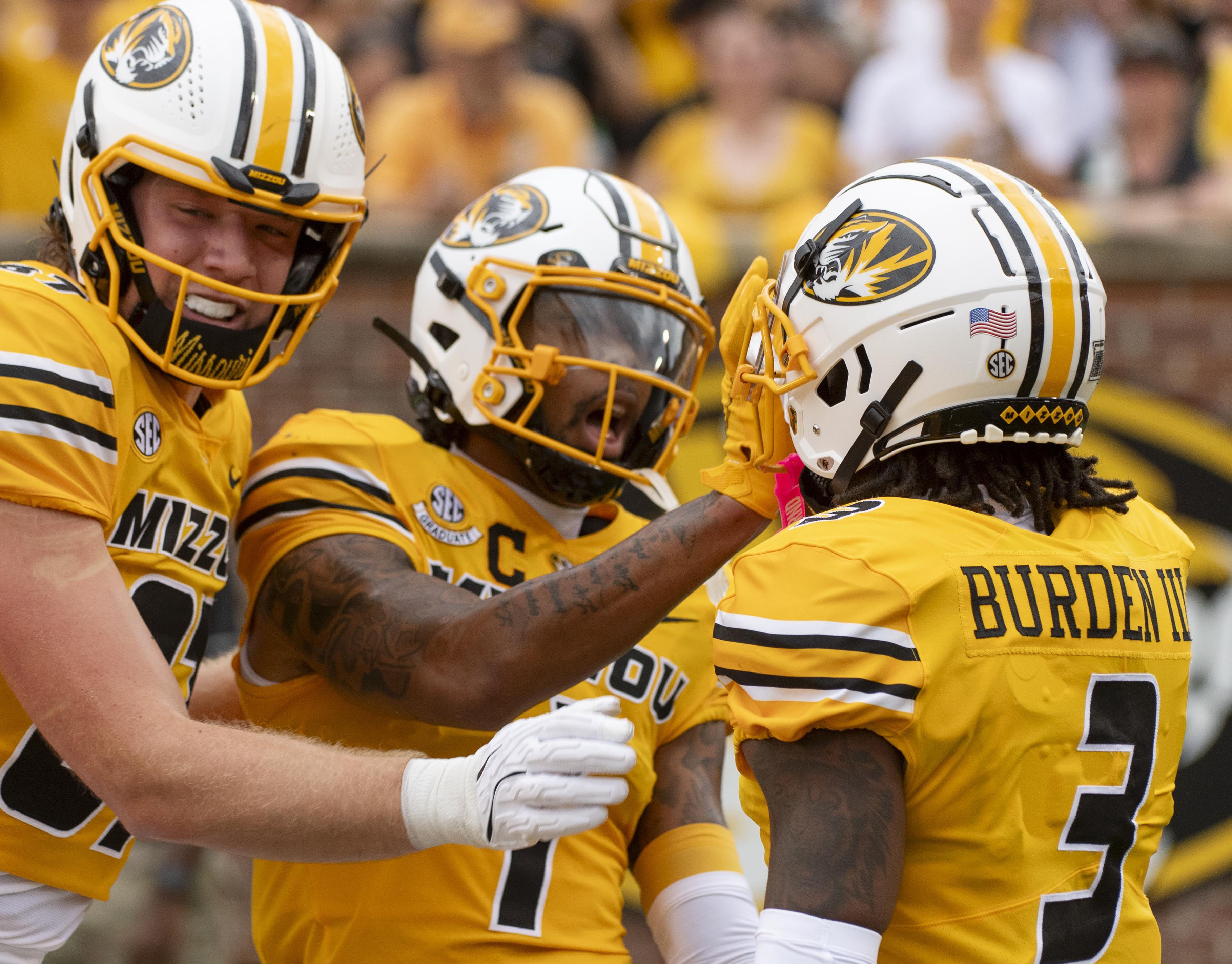 Missouri wide receiver Luther Burden III (3) celebrates after his touchdown with teammates Brett Norfleet, left, and Theo Wease Jr., center, during the first quarter of an NCAA college football game against Vanderbilt, Saturday, Sept. 21, 2024, in Columbia, Mo. 