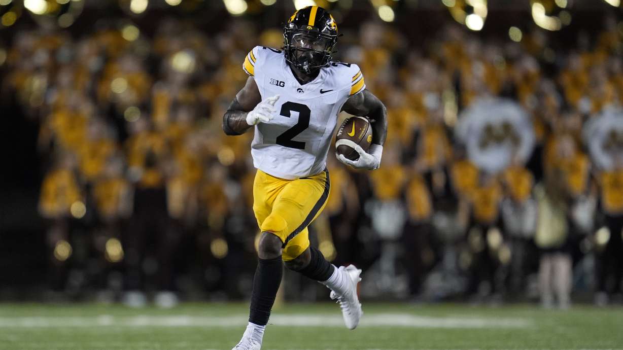 Iowa running back Kaleb Johnson runs with the ball during the second half of an NCAA college football game against Minnesota, Saturday, Sept. 21, 2024, in Minneapolis.