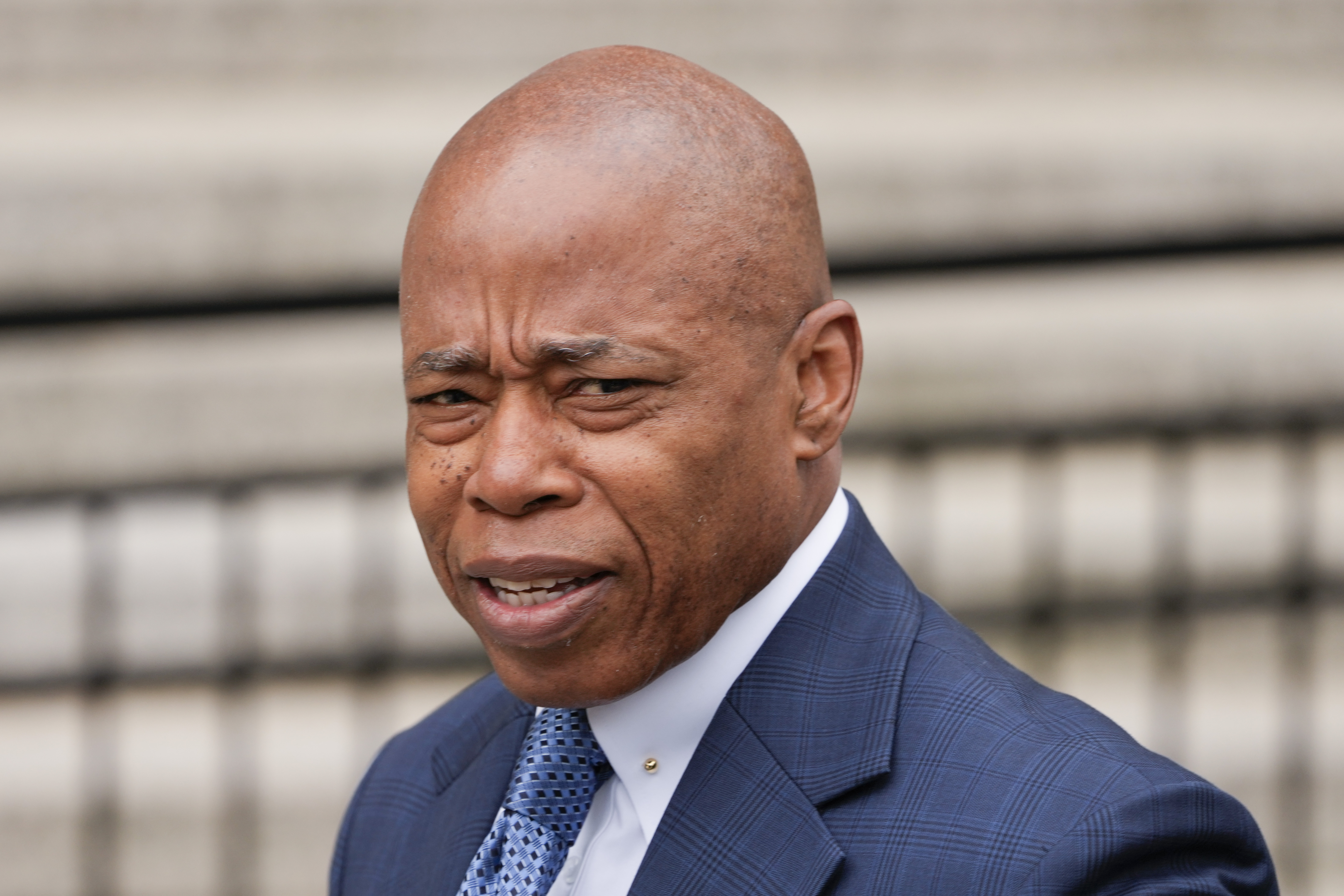 New York City Mayor Eric Adams arrives to court in New York on Wednesday. Federal prosecutors say they might bring additional charges against Adams and indict others in the corruption case against him.