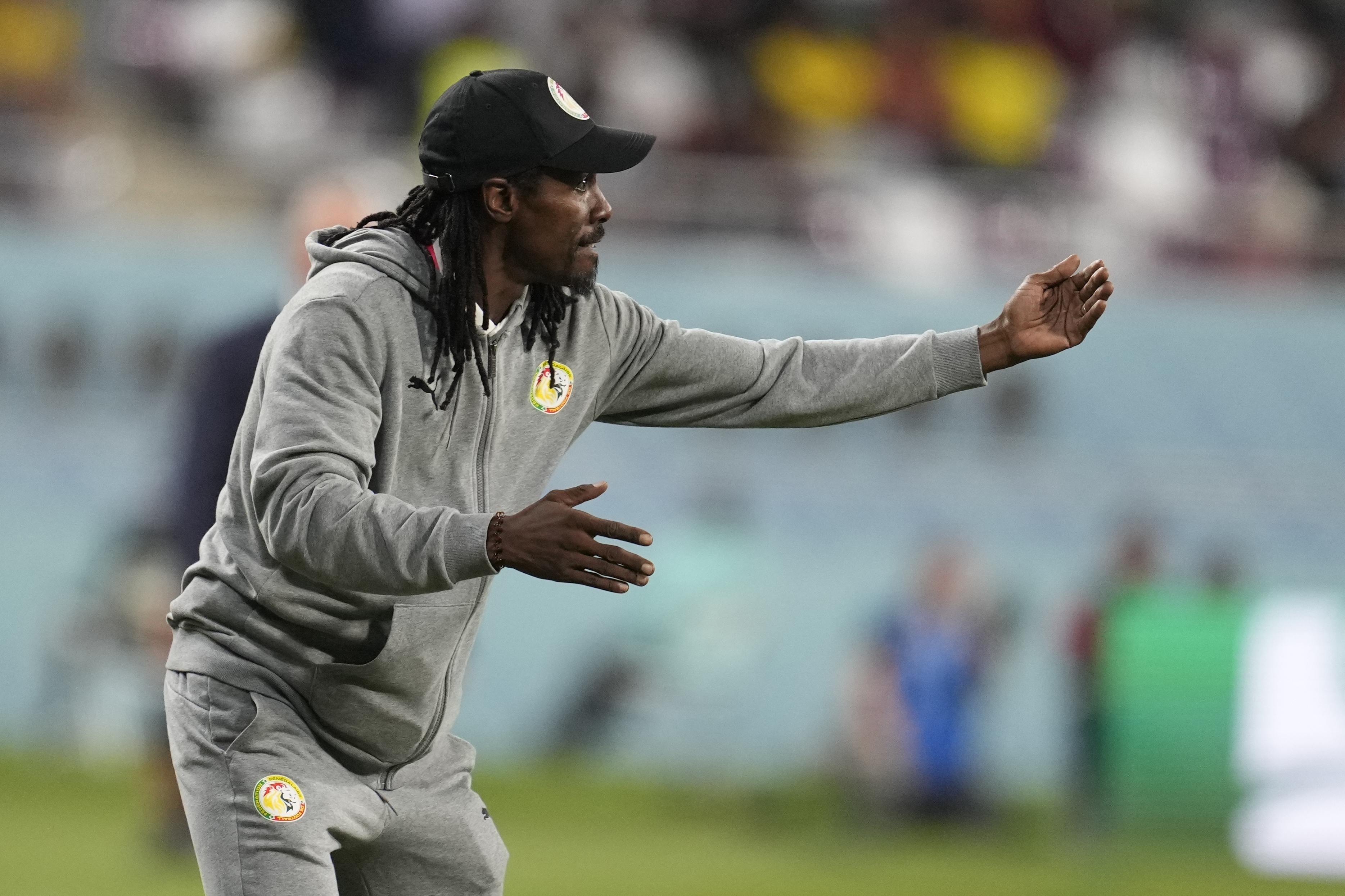 FILE - Senegal's head coach Aliou Cisse directs his players during the World Cup group A soccer match between Ecuador and Senegal, at the Khalifa International Stadium in Doha, Qatar, Nov. 29, 2022. 