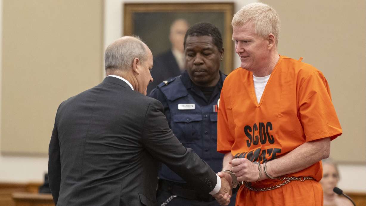 Alex Murdaugh speaks with his attorney Jim Griffin during his sentencing for stealing from 18 clients, Nov. 28, 2023, at the Beaufort County Courthouse in Beaufort, S.C. A federal court has rejected Murdaugh's request to throw out his 40-year sentence for stealing from clients.