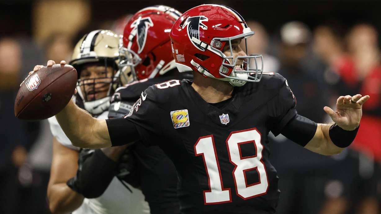 Atlanta Falcons quarterback Kirk Cousins (18) works against the New Orleans Saints during the first half of an NFL football game, Sunday, Sept. 29, 2024, in Atlanta.