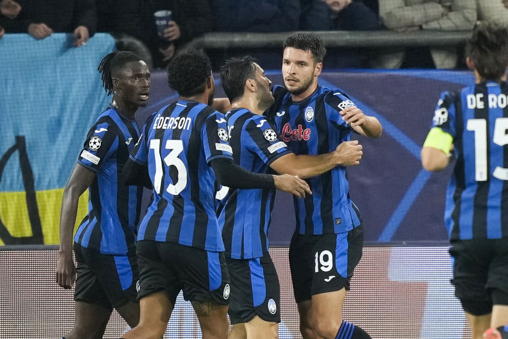 Atalanta's Berat Djimsiti celebrates with his teammates after scoring the opening goal during the Champions League opening phase soccer match between Shakhtar Donetsk and Atalanta at the Arena AufSchalke in Gelsenkirchen, Germany, Wednesday Oct. 2, 2024. 