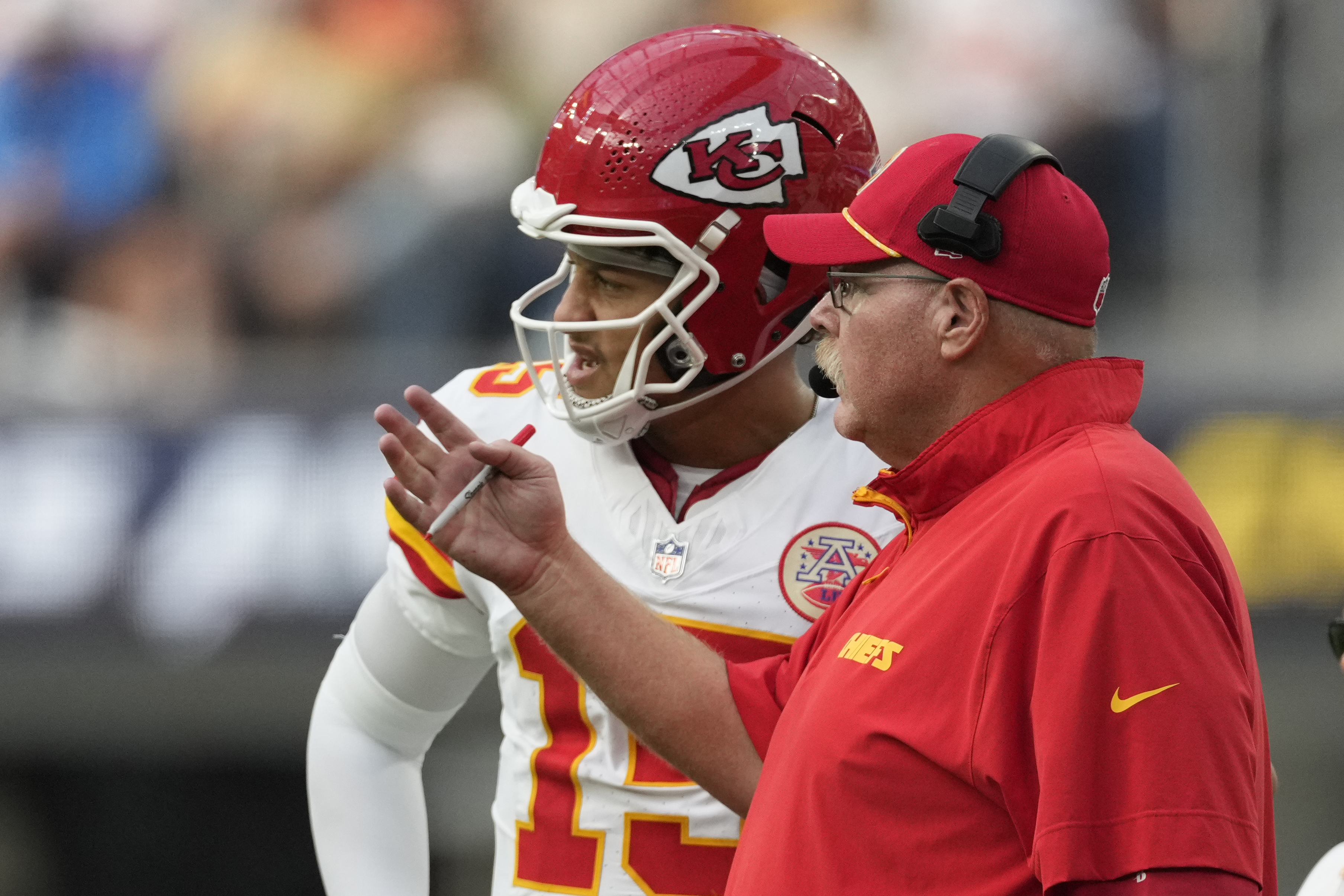 Kansas City Chiefs quarterback Patrick Mahomes, left, talks with head coach Andy Reid during the second half of an NFL football game against the Los Angeles Chargers Sunday, Sept. 29, 2024, in Inglewood, Calif.