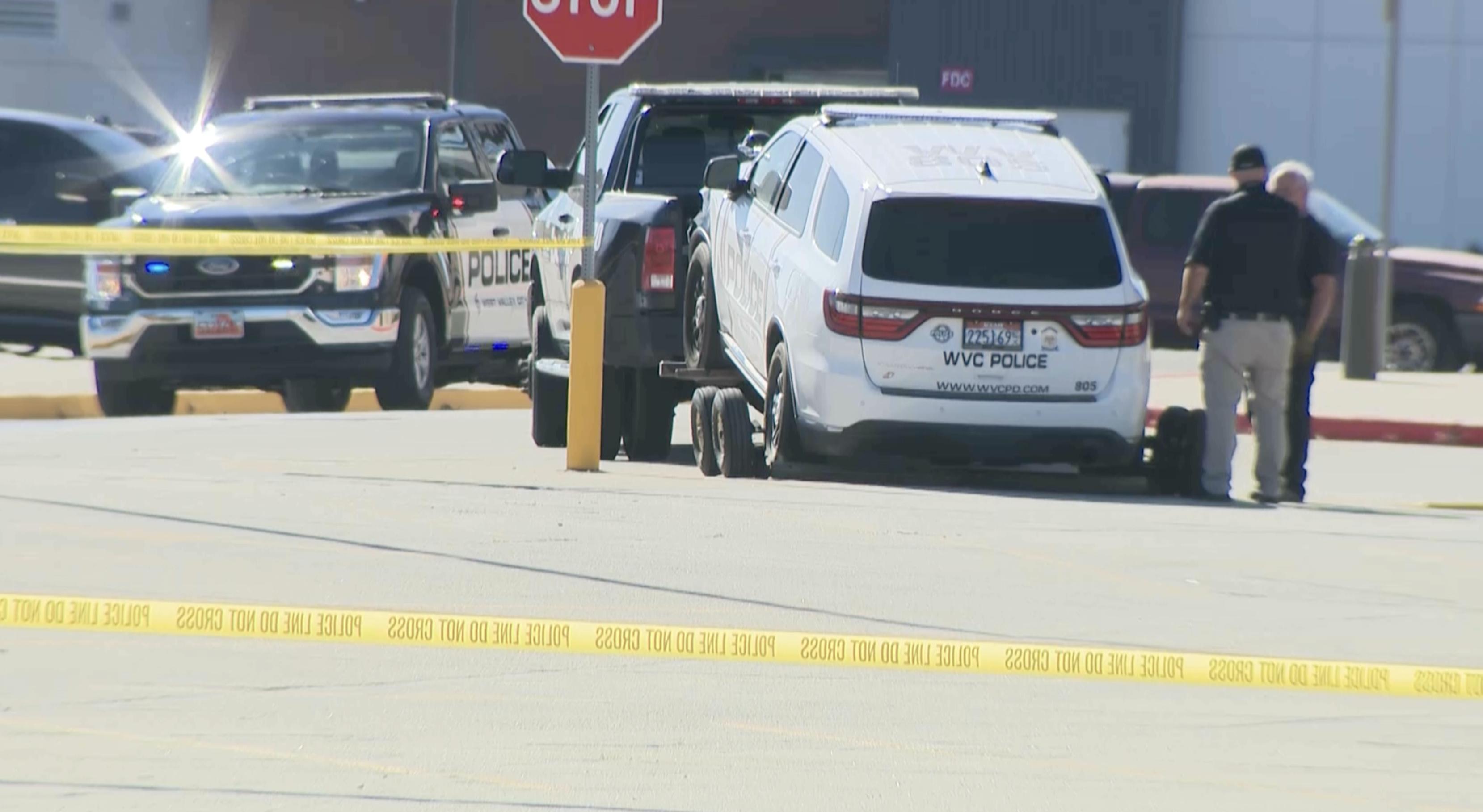 A police vehicle is towed away from the scene of a police pursuit and head-on crash that killed a woman near Valley Fair Mall in West Valley City on Wednesday. The driver who was arrested also rammed two police vehicles.