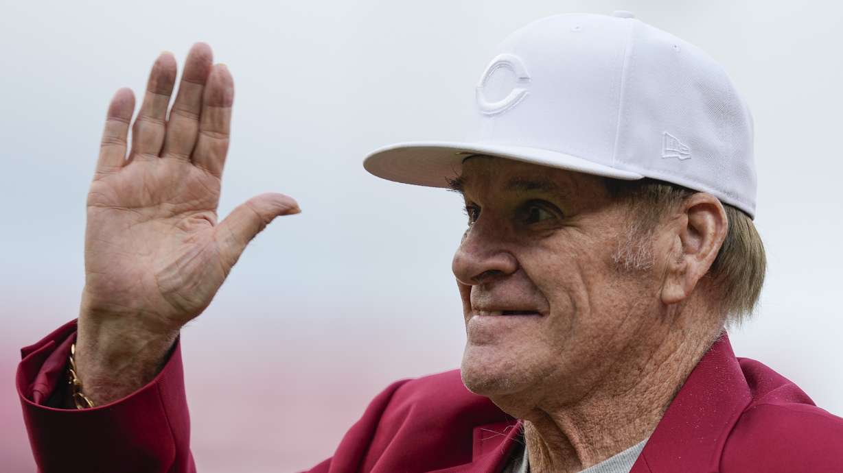 FILE - Former Cincinnati Reds player Pete Rose waves to fans after being introduced during the Reds Hall of Fame Induction Ceremony, July 15, 2023, in Cincinnati.