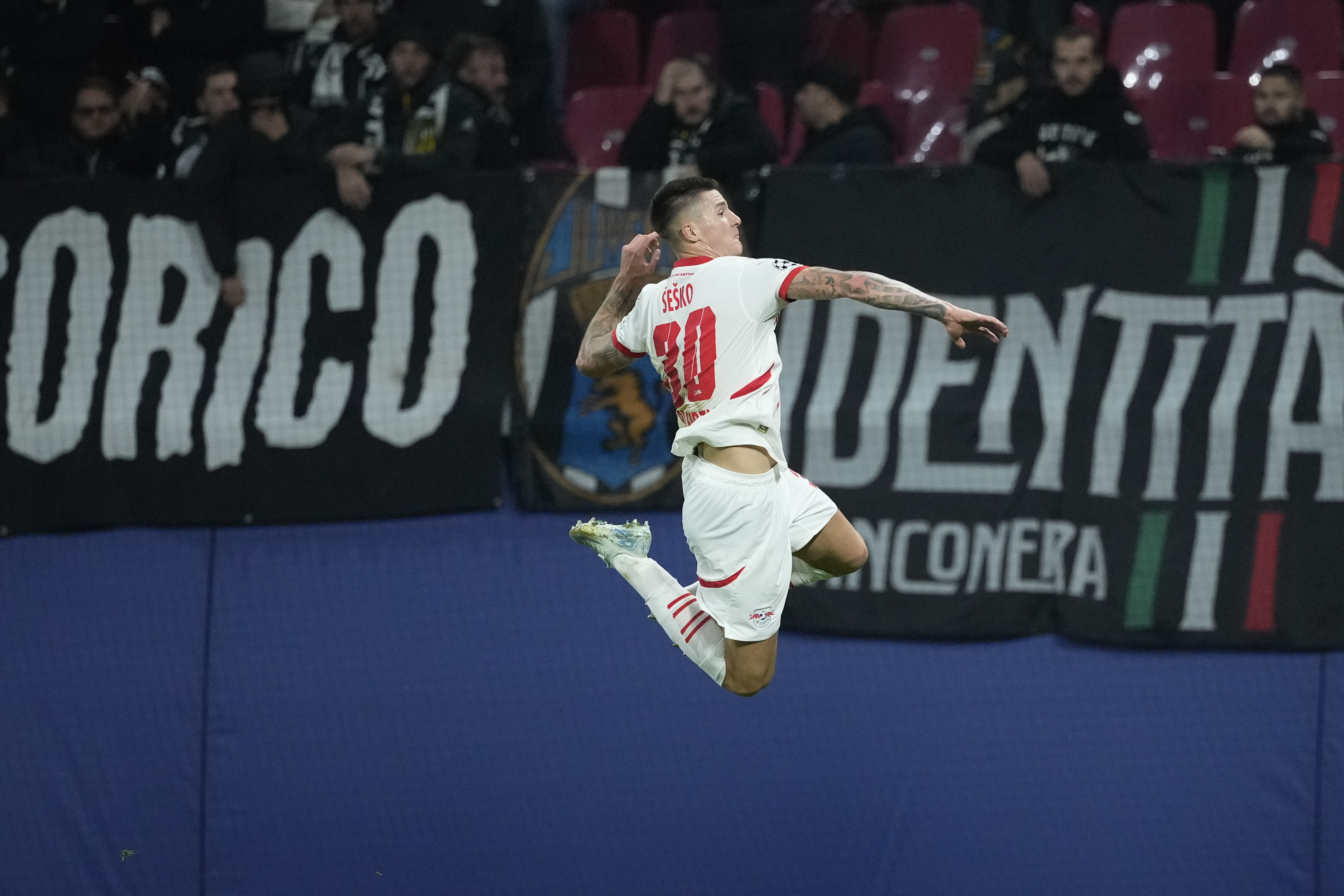 Leipzig's Benjamin Sesko celebrates after he scored during the UEFA Champions League opening phase soccer match between Leipzig and Juventus in Leipzig, Germany, Wednesday, Oct. 2, 2024.