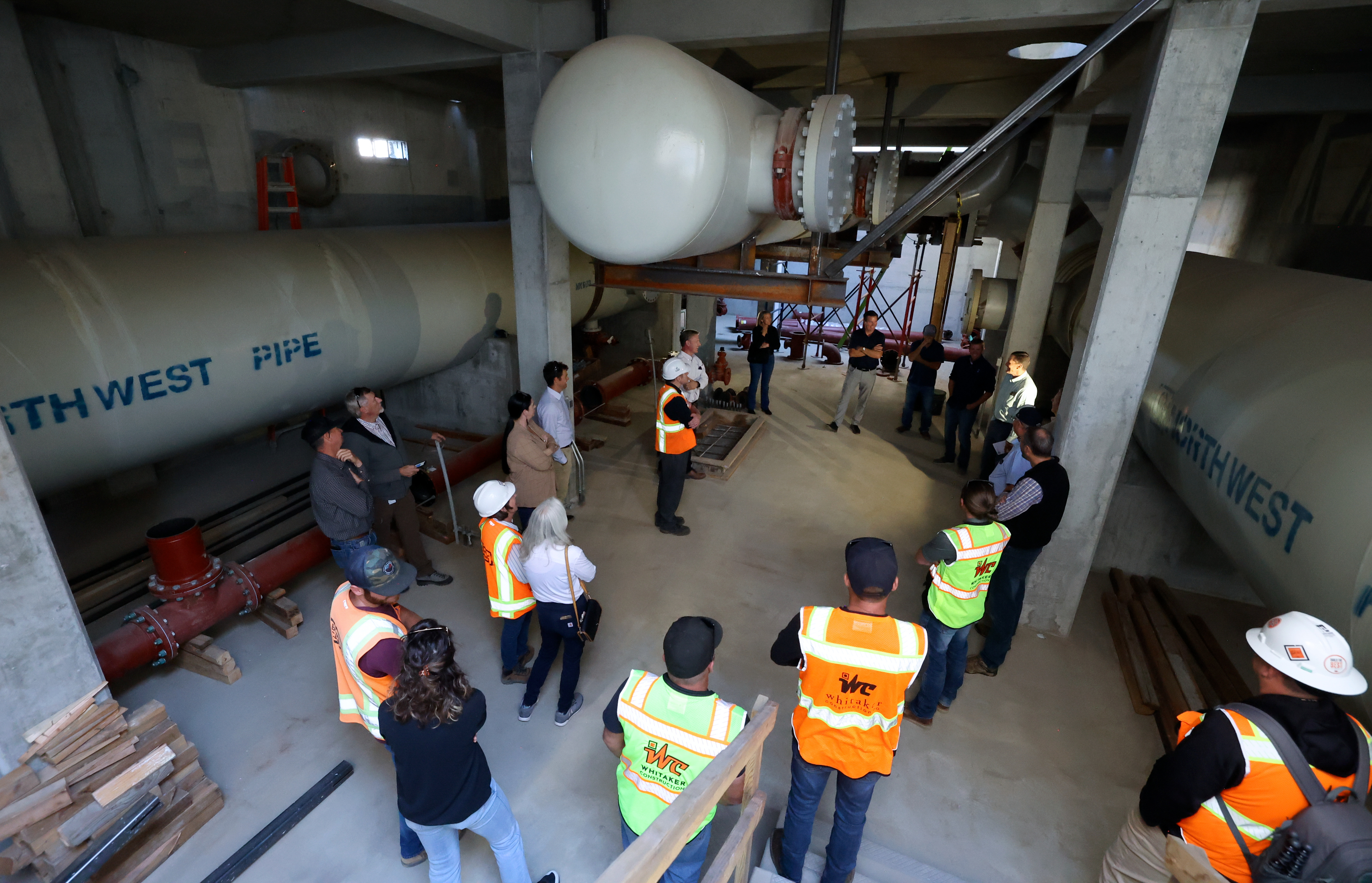 People tour a new pump station that is part of an $81 million seismic resilience project for the Davis Aqueduct, to increase water security in the event of a major earthquake, in South Weber on Wednesday.