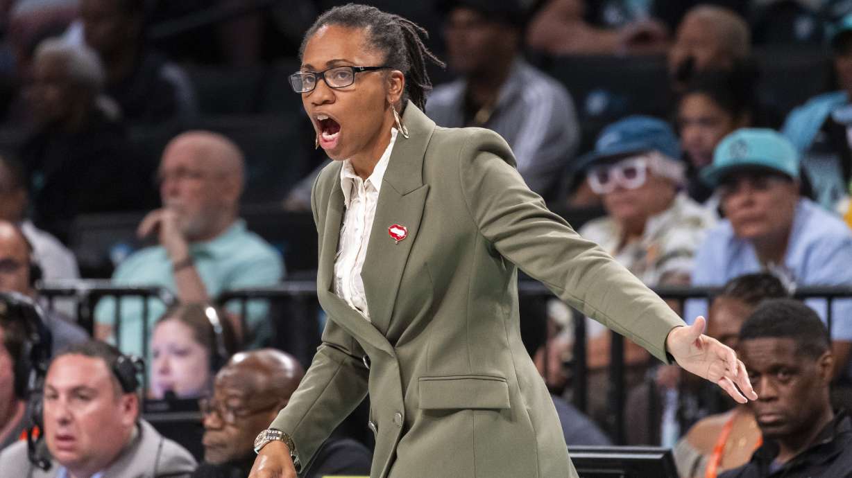 Atlanta Dream head coach Tanisha Wright reacts during the first half of a WNBA basketball first-round playoff game against the New York Liberty, Sunday, Sept. 22, 2024, in New York.