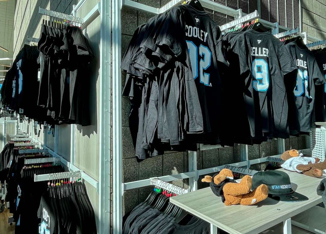 Several player jersey t-shirts options on display inside a Utah Hockey Club exclusive store on the fifth floor of the Delta Center.