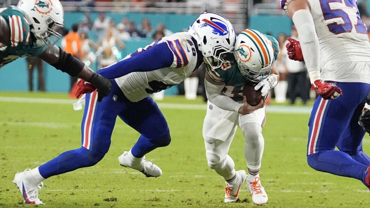 Buffalo Bills linebacker Von Miller (40) sacks Miami Dolphins quarterback Skylar Thompson (19) during the second half of an NFL football game, Thursday, Sept. 12, 2024, in Miami Gardens, Fla.