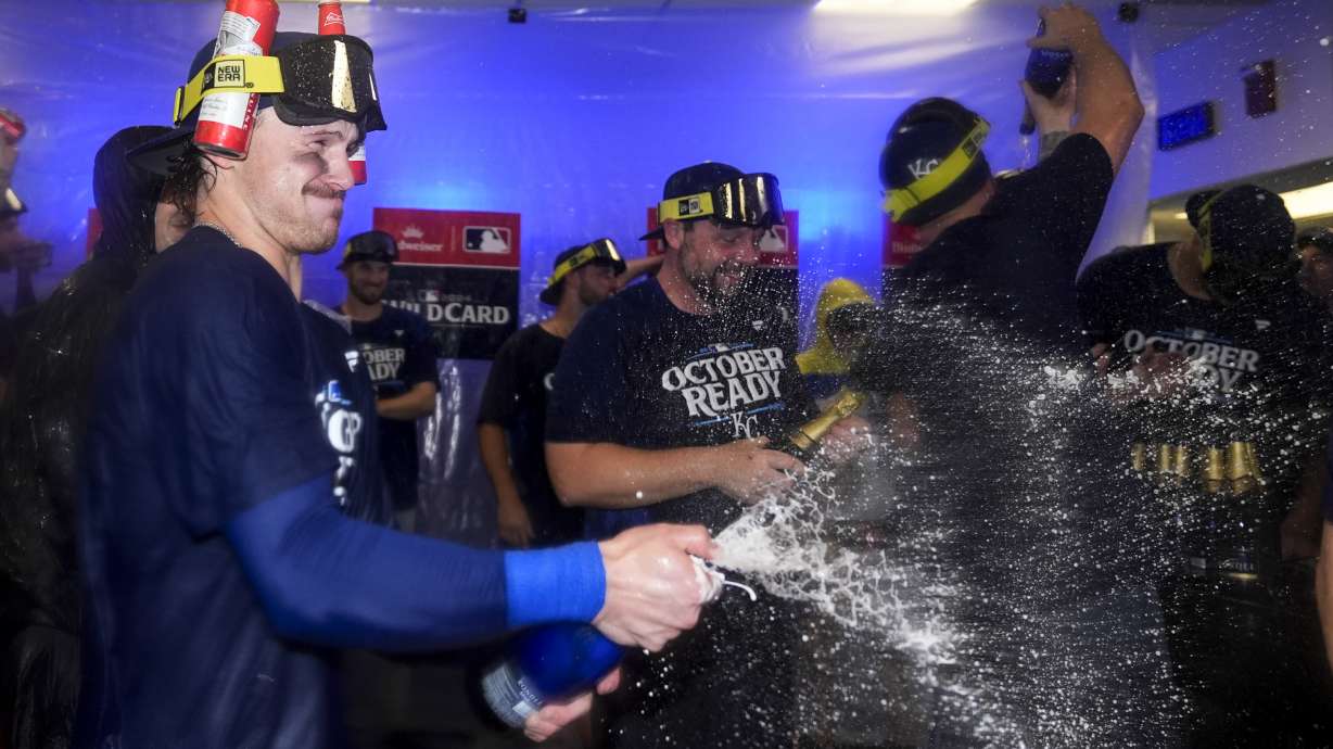 Kansas City Royals shortstop Bobby Witt Jr. celebrates with teammates after defeating the Baltimore Orioles 2-1 in Game 2 of an AL Wild Card Series baseball game, Wednesday, Oct. 2, 2024 in Baltimore.
