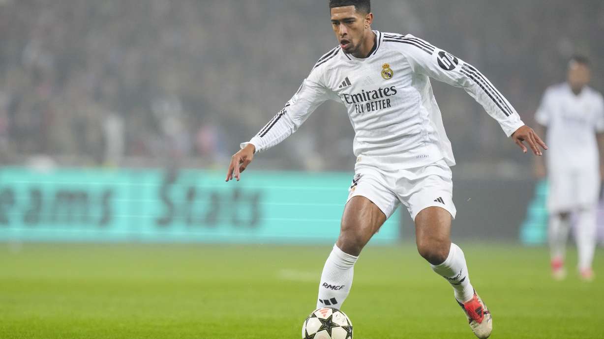 Real Madrid's Jude Bellingham runs with the ball during the Champions League opening phase soccer match between Lille and Real Madrid at the Stade Pierre Mauroy in Villeneuve-d'Ascq, outside Lille, France, Wednesday, Oct. 2, 2024.
