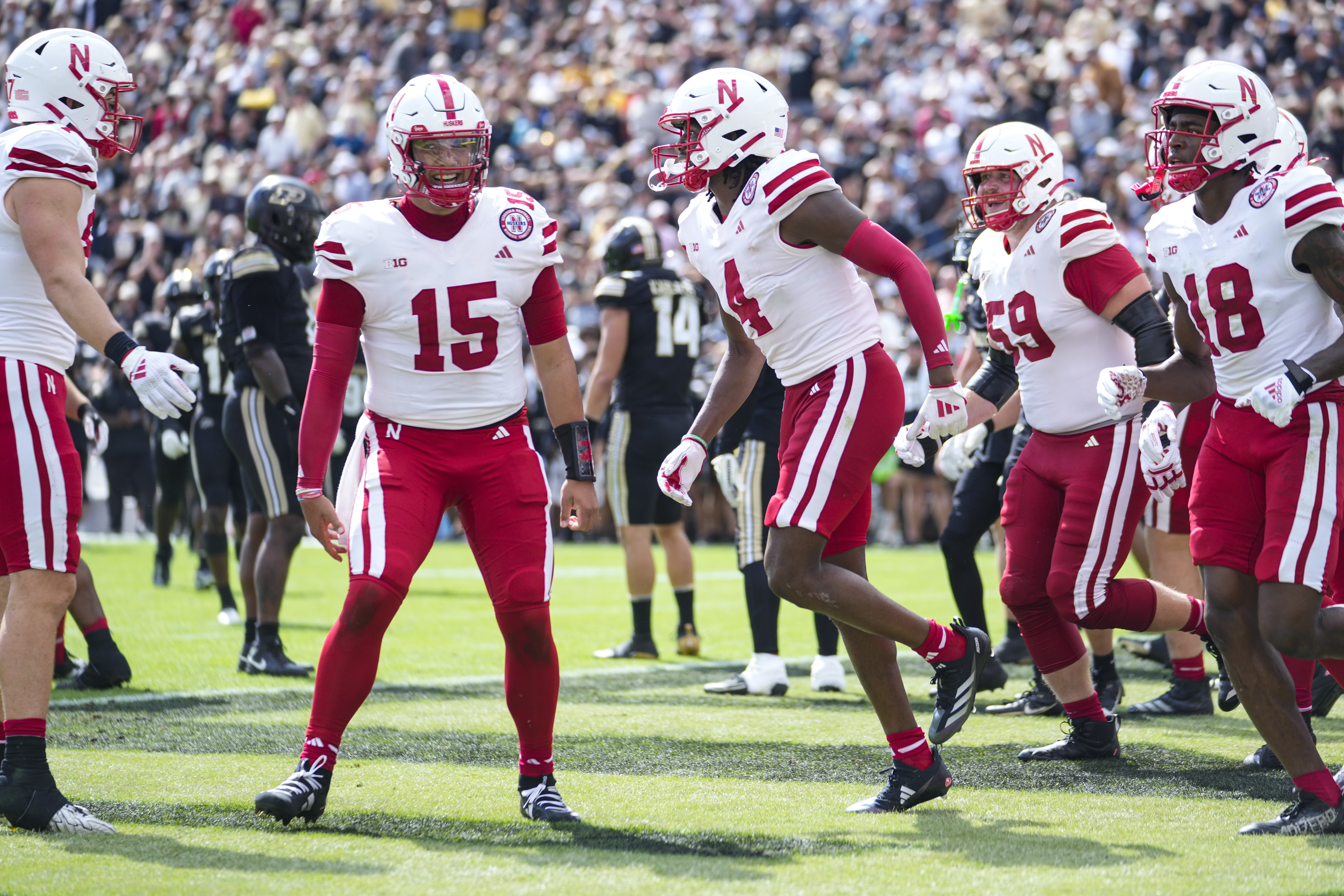 Nebraska wide receiver Jahmal Banks (4) celebrates touchdown catch with quarterback Dylan Raiola (15) during the second half of an NCAA college football game in West Lafayette, Ind., Saturday, Sept. 28, 2024.