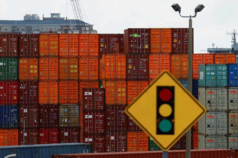 Containers are stacked at the Portsmouth Marine Terminal, as port workers from the International Longshoremen's Association participate in a strike, in Portsmouth, Va., Wednesday.