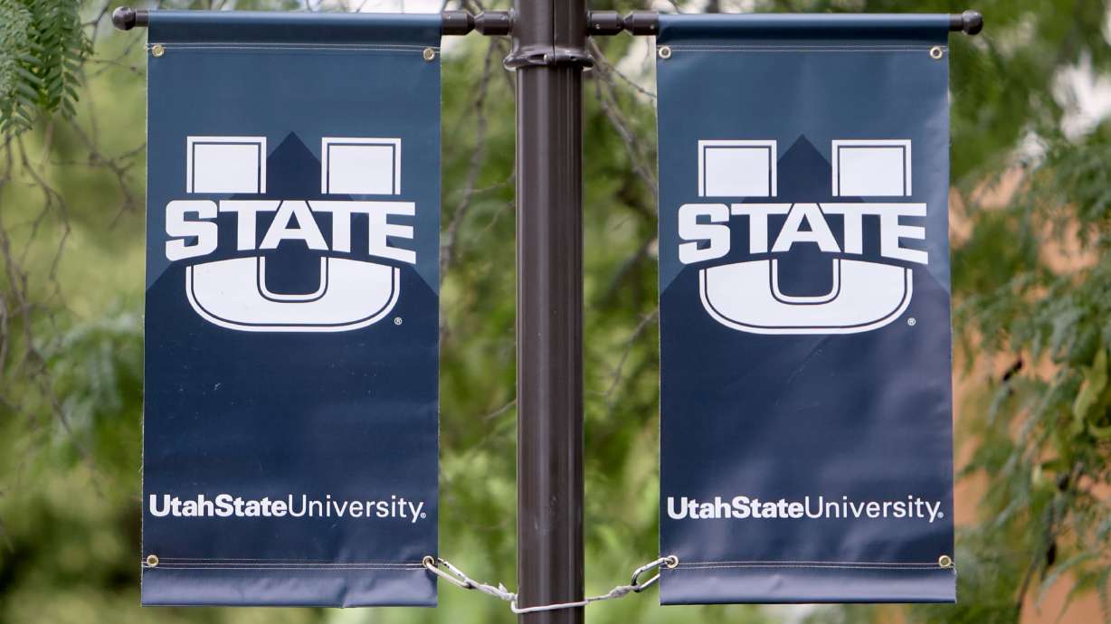 Banners are pictured hanging on the Utah State University campus in Logan on Wednesday, Aug. 14, 2024.
