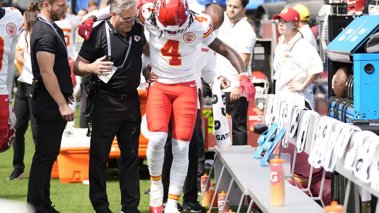 Kansas City Chiefs wide receiver Rashee Rice (4) is assisted after being injured during the first half of an NFL football game against the Los Angeles Chargers Sunday, Sept. 29, 2024, in Inglewood, Calif.