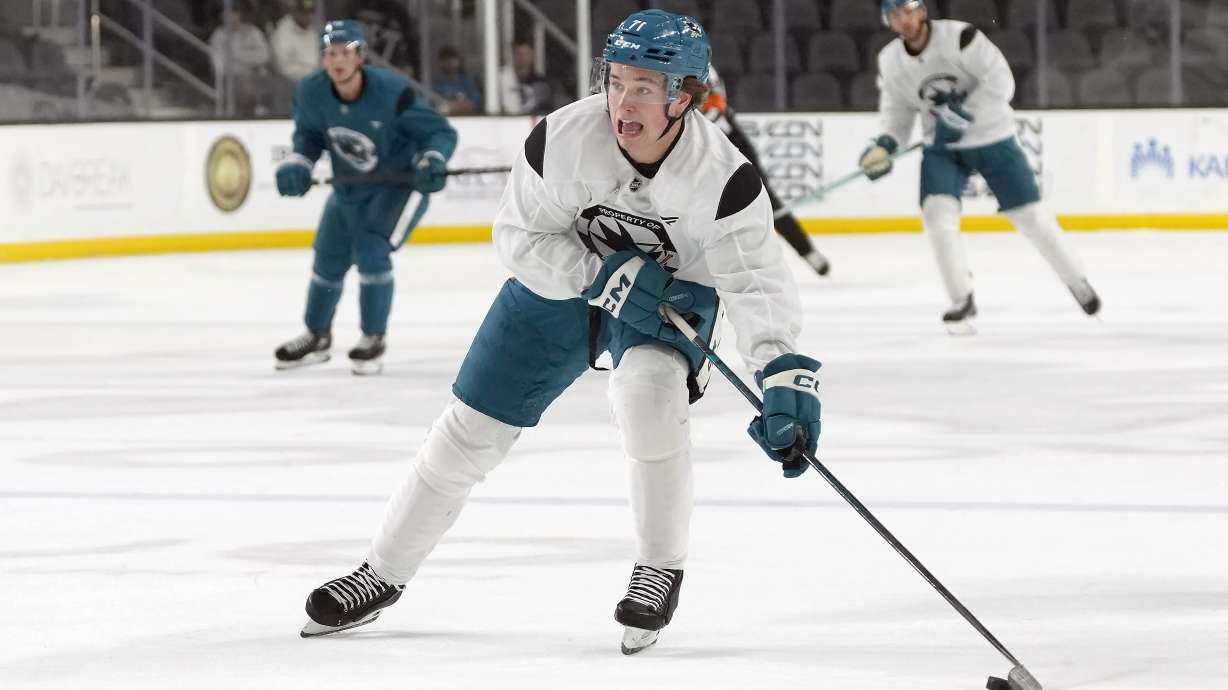 San Jose Sharks' Macklin Celebrini skates with the puck during a scrimmage at the NHL hockey team's practice facility in San Jose, Calif., Thursday, Sept. 19, 2024.