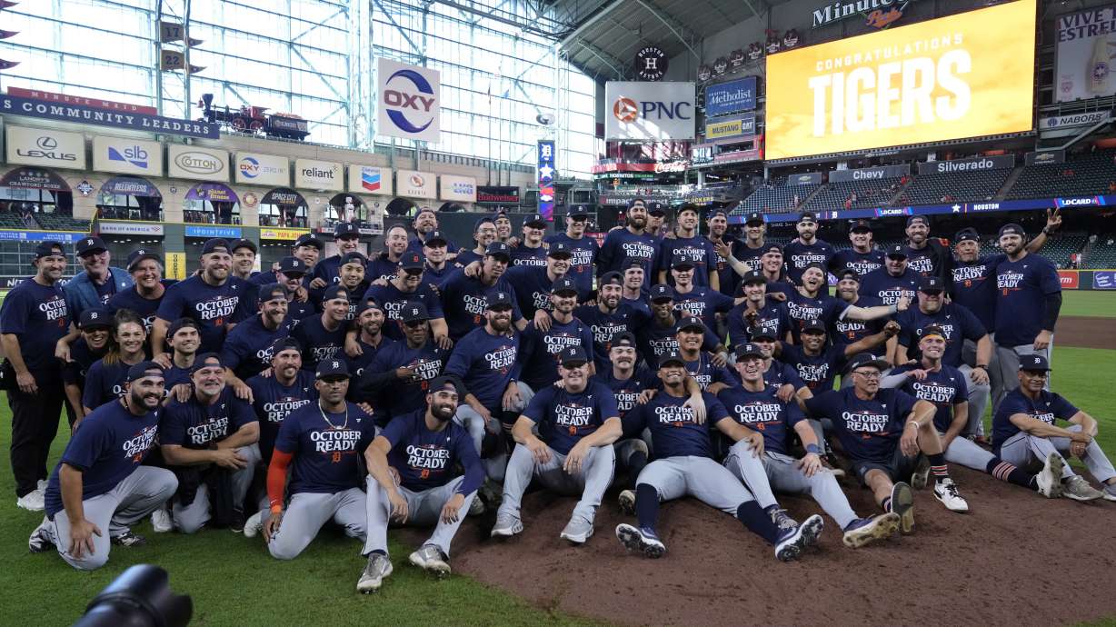 The Detroit Tigers pose for a team photo after their 5-2 win against the Houston Astros in Game 2 of an AL Wild Card Series baseball game Wednesday, Oct. 2, 2024, in Houston.