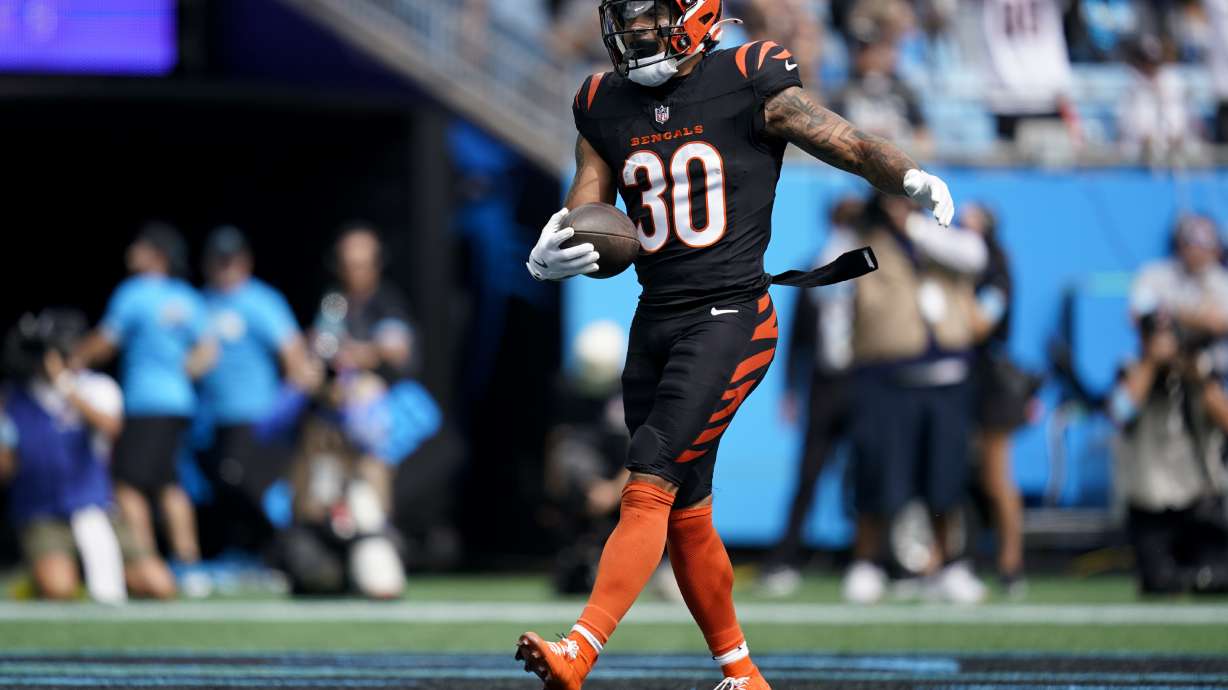 Cincinnati Bengals running back Chase Brown celebrates after scoring against the Carolina Panthers during the first half of an NFL football game, Sunday, Sept. 29, 2024, in Charlotte, N.C.