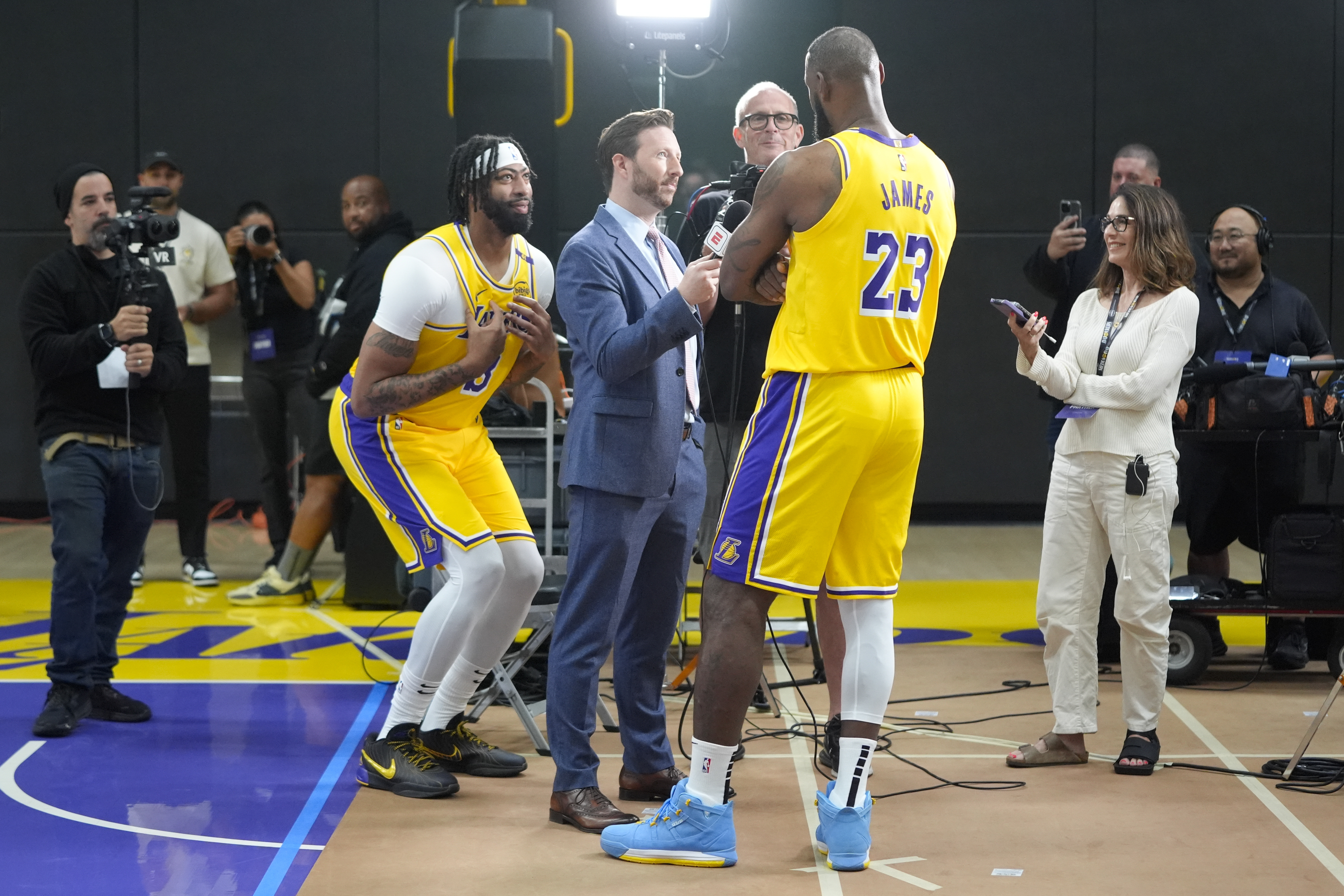 Los Angeles Lakers' Anthony Davis, left, jokes around as LeBron James participates in an interview during the NBA basketball team's media day in El Segundo, Calif., Monday, Sept. 30, 2024.