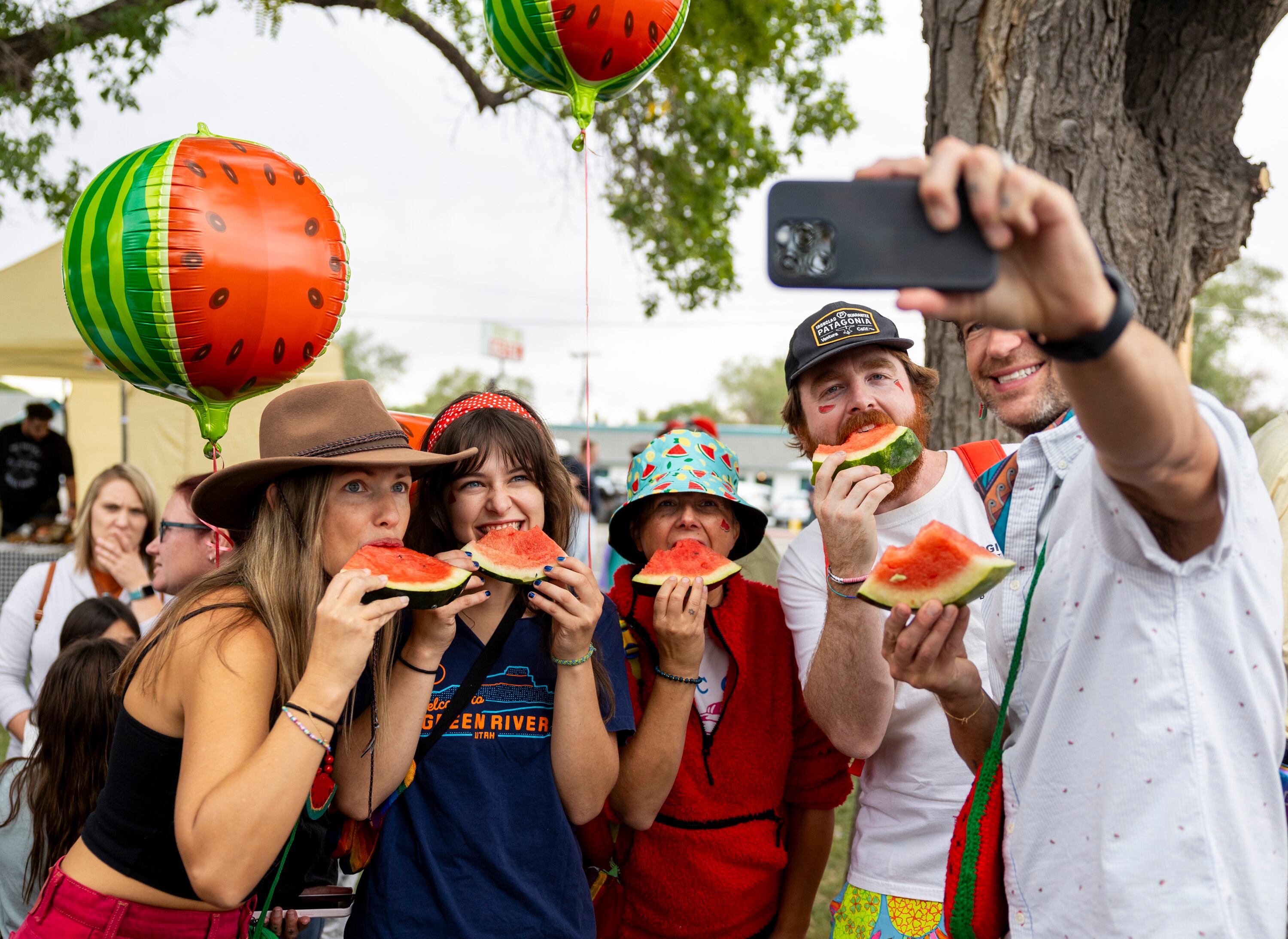 From right to left, Matt Beatty, Noah Myers, Vanessa Adams, Bella Beatty and Amy Beatty take a selfie eating watermelon during the 118th annual Melon Days Festival in Green River on Saturday, Sept. 21. The Beattys have been coming to Green River’s Melon Days Festival with family and friends for over a decade.