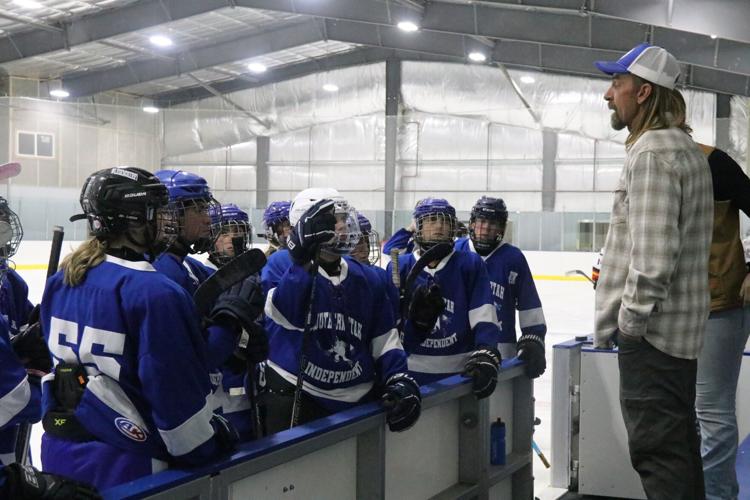 Southern Utah Independent hockey coach Chad Fain talks to his players before their game versus the Tooele Outlaws in the new KJ's Ice Barn arena, Enoch, Sept. 27.