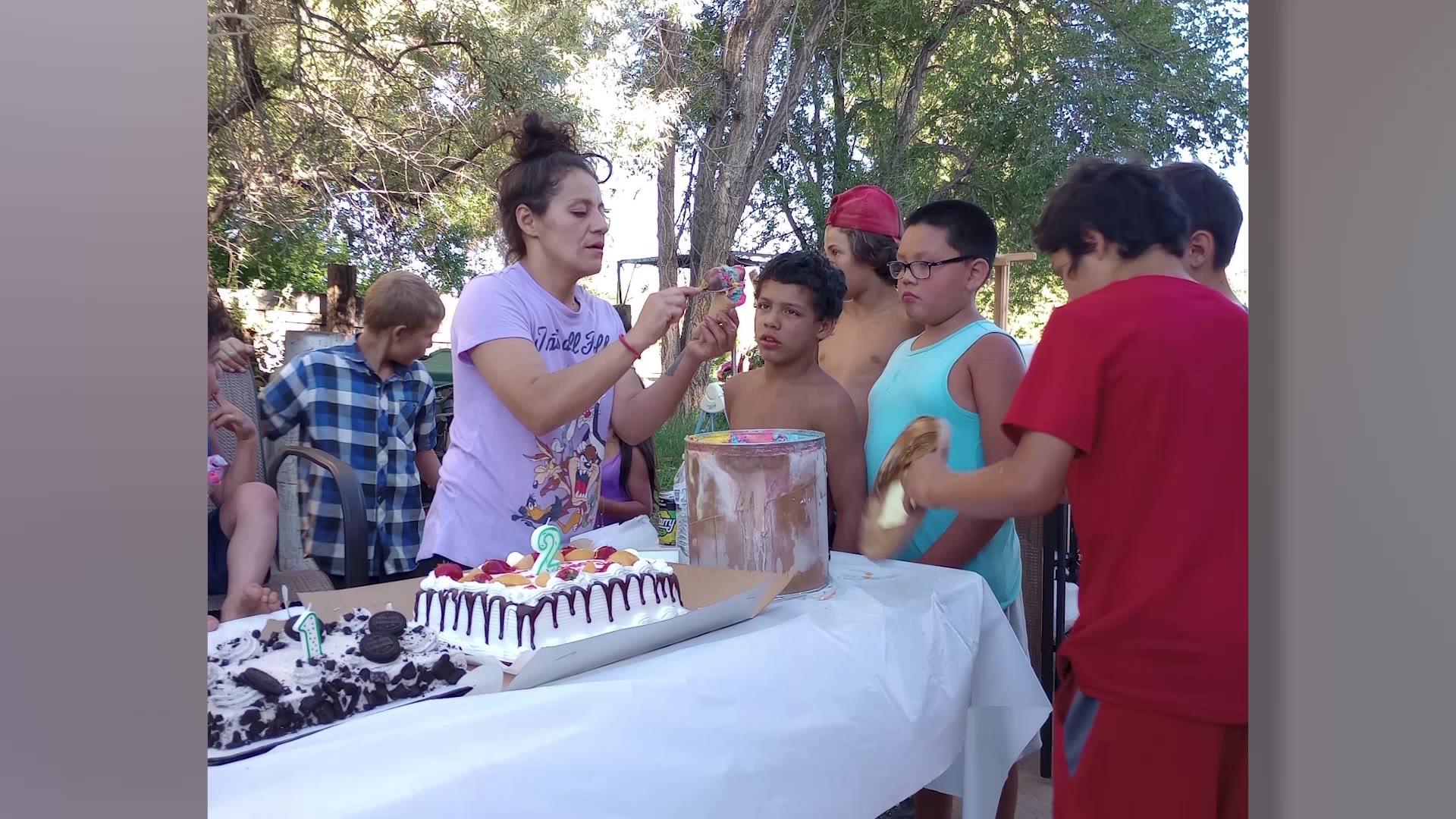 Norma Jones helps kids at a birthday party by serving them ice cream in this undated photo. She and her daughter died in a crash on U.S. 40 on Oct. 1.