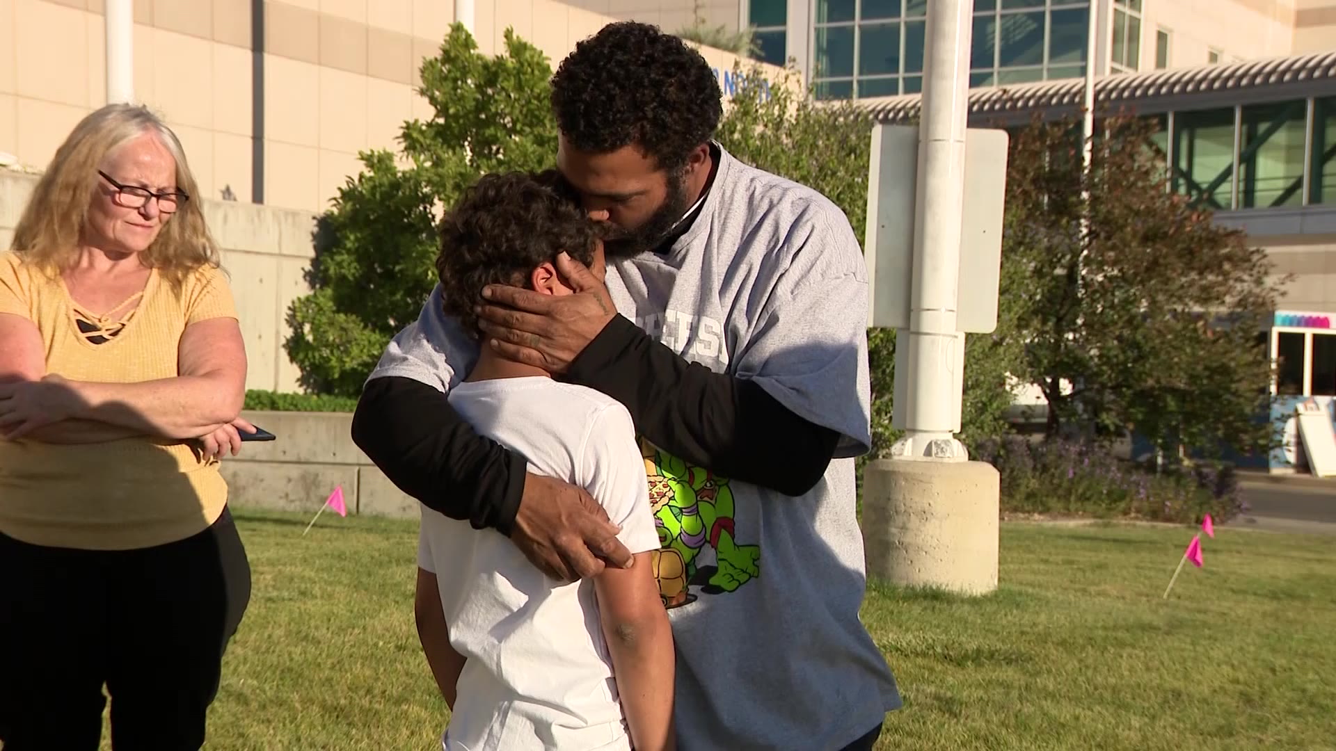 Fred Jones with his oldest son, Freddie, outside of the hospital.