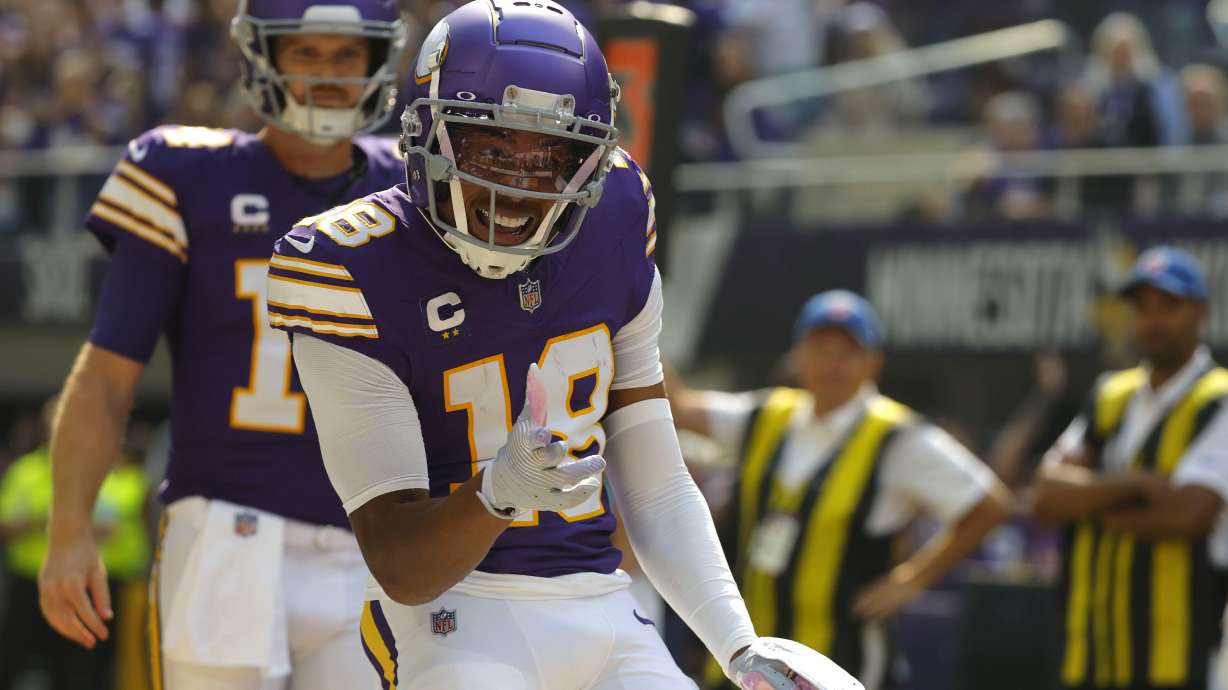 Minnesota Vikings wide receiver Justin Jefferson (18) celebrates after catching a touchdown pass during the first half of an NFL football game against the Houston Texans, Sunday, Sept. 22, 2024, in Minneapolis.