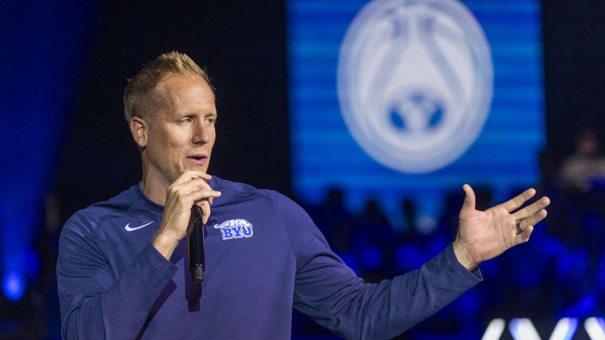 Brigham Young head coach Kevin Young talks to fans and students during Marriott Madness at the Marriott Center on the campus of Brigham Young University in Provo on Thursday, Oct. 3, 2024.