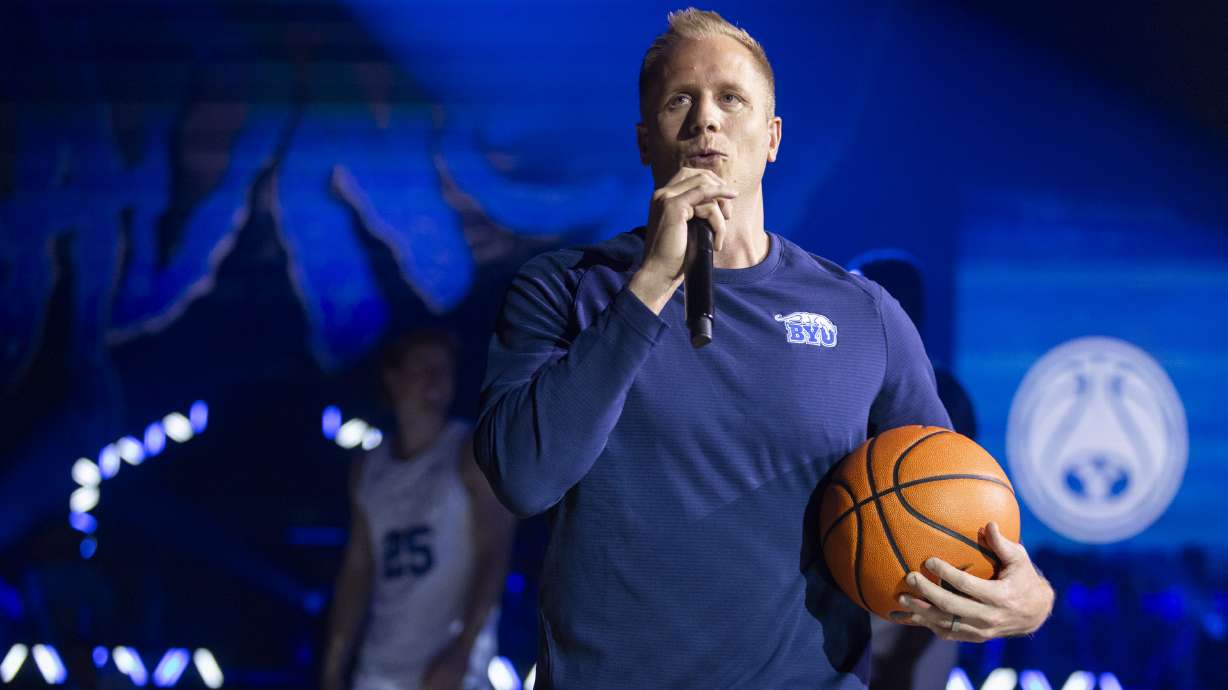 Brigham Young Cougars head coach Kevin Young talks to fans and students during Marriott Madness at the Marriott Center on the campus of Brigham Young University in Provo on Thursday, Oct. 3, 2024.